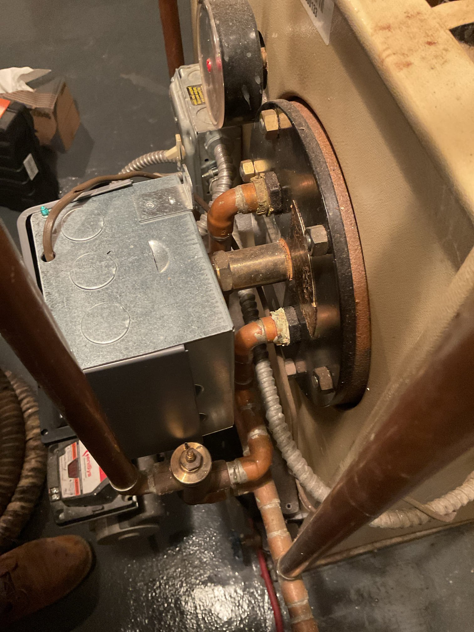 Performed precision oil tune up on 15 year old Weil McLain oil boiler. Checked all electrical connections and components. Replaced Rf1 oil filter, pump strainer, and 1.25 80b nozzle. Vacuumed soot from heat exchanger and smoke pipe and cleaned chimney base. Used furnace cement to seal around chimney. Found mixing valve is not working correctly on boiler this is causing the inconsistency in hot water.  Checked over aquastat settings. Performed combustion test. Oil boiler is working properly at time of service. 