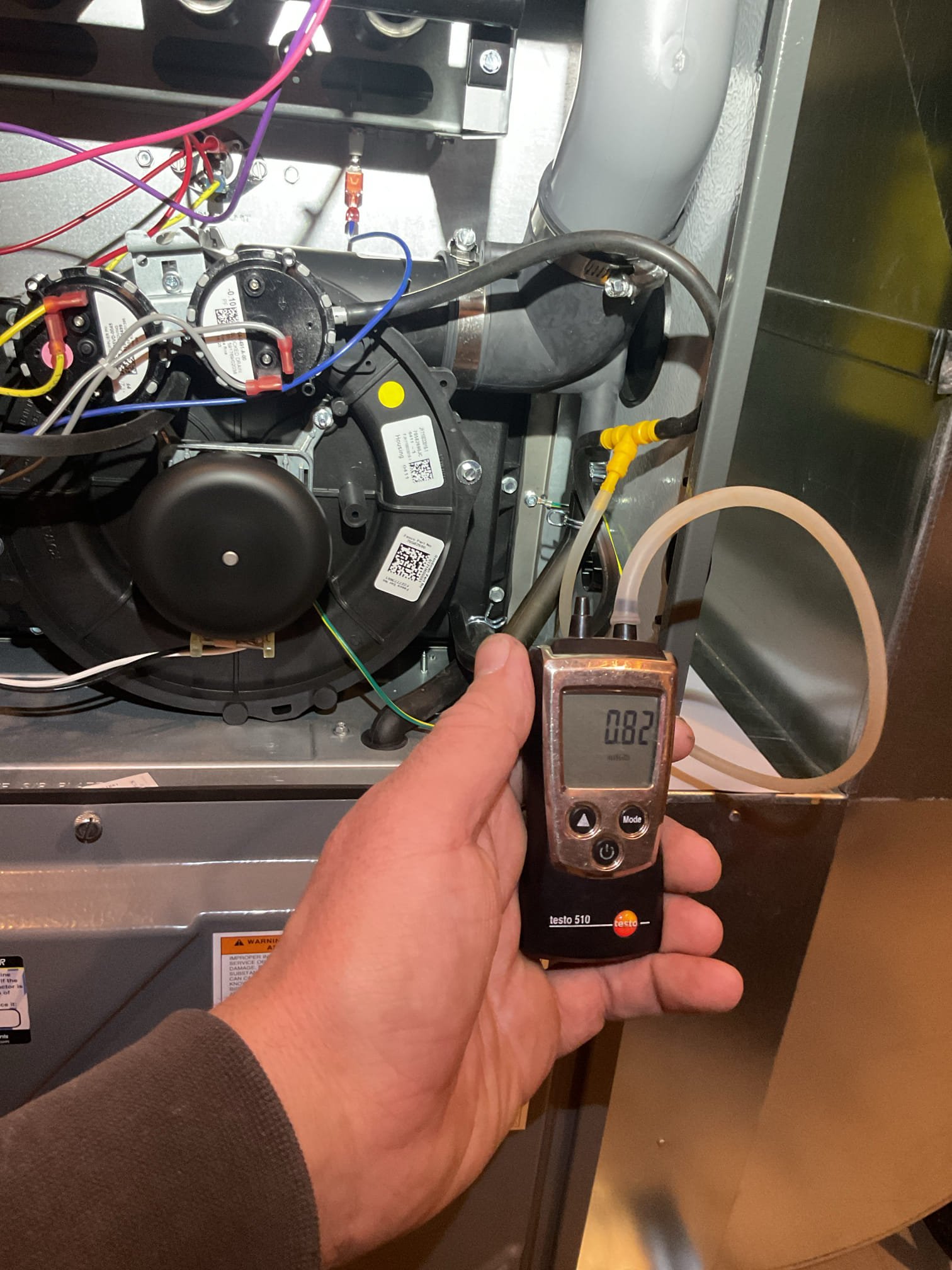 2.5 yr old high efficiency gas furnace off on pressure switch error.  Found pressure switch kit stuck closed.  Cleared tubing and freed up pressure switches.  Tested system operation and cycled several times.  System now operating properly but issue could recur.   Recommend replacing pressure switch kit to avoid future issues.  Ordered part for return visit.  (Part warranty only)

1/6/26
Replaced dual pressure switch.  Tested system.
Verified draft at both pressure switch ports.
Combustion and draft tests: Pass. 
Measured temperature rise.

System operating well at this time,
*This repair includes 2 year part and warranty. 

Collected balance. 


