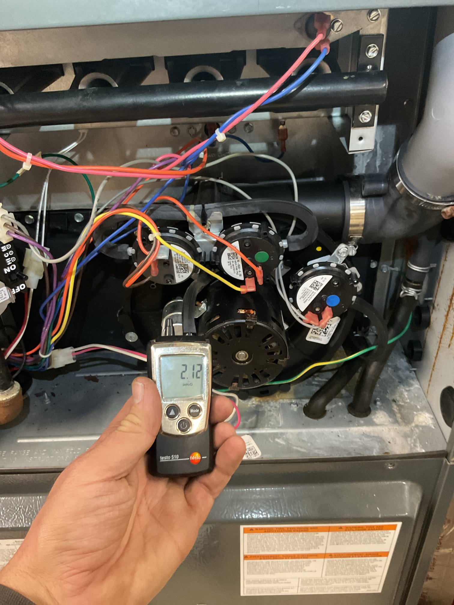 Homeowner described that furnace  would light across but quickly shut off thereafter. 10 seconds or so.
Found dirty flame sensor. Removed and cleaned with fine steel wool.
Tested at 2.1uA DX

Found some after under inducer very minimal. Water is NOT coming from second heat exchanger cover plate, but from the inducer itself. I caulked the seam at bottom of inducer where leak typically occurs. The best way to address this issue is to install a 3” tee with bushing and barb in exhaust that will divert condensation produced in exhaust directly to the condensate pump. 

Reminded Michael that the burners are in bad shape. Recommend upgrading to stainless steel. Emailed estimate again 

Combustion and draft tests: Pass. 

System operating well at this time, 
