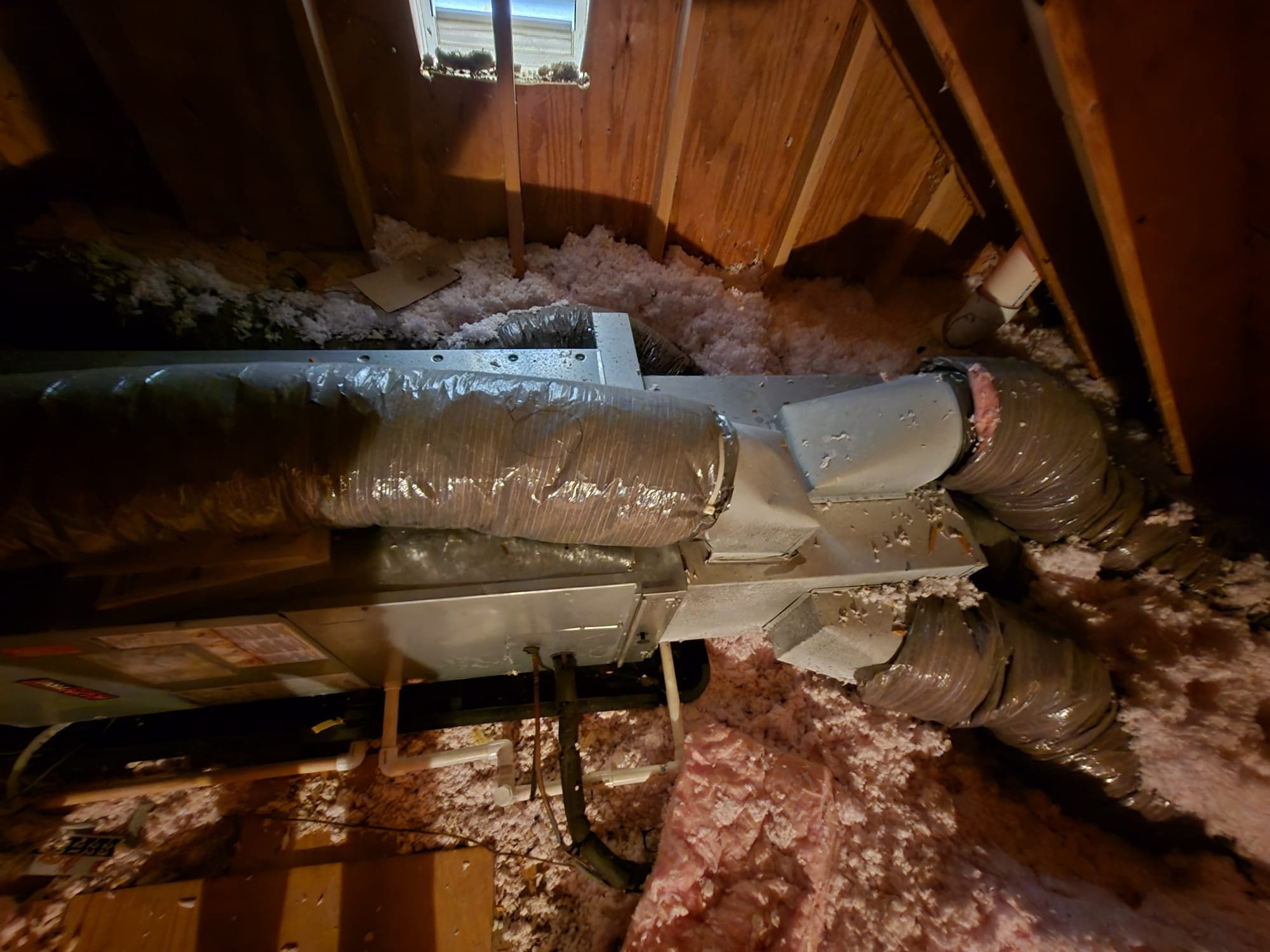 2 ton Heat pump with 7.5Kw electric heat. Dates to 2021

Air handler in attic, 
There are combinations of issues with refrigerant side of the system.
System run for 10 seconds and immediately drops to less than 35 PSI but high side close to target.
There is a severe refrigerant restriction, an undercharge (and therefore refrigerant leak) Or a combination of these 2 things.
System does not run long enough for me to pin point where the restriction could be.

The other reason I believe there is a restriction as opposed to just an undercharge is that if you run the compressor and it stops the head pressure remains very high and the suction low. You will expect some difference in standing pressure (compressor idle)  but not nearly not to this extreme (74psi/215 psi)

All these are observations of a poor quality installation 

At a minimum the refrigerant needs to be recovered and a new outdoor unit installed along with new indoor metering device (piston)
There are too many possible variable