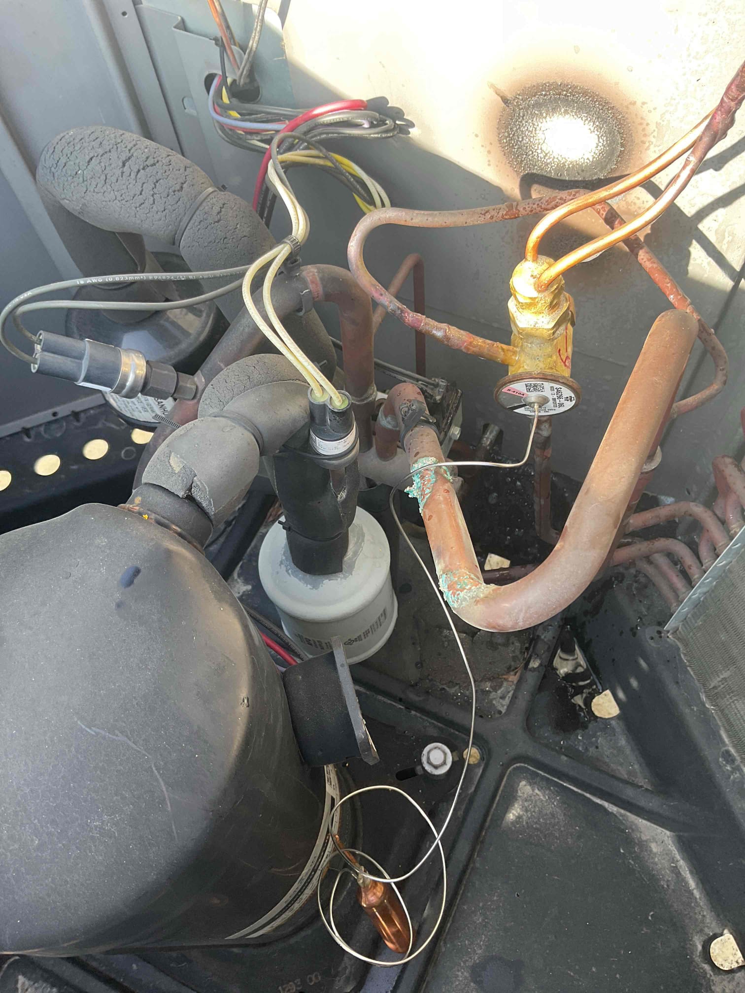 Recovers all refrigerant from the system. Removed old outdoor txv and bi flow filter dryer. Installed new txv and filter dryer. Pressure tested at 320 psi nitrogen and soap checked. Vacuumed down system to 380 microns. Added in 6 lbs 8ozs of r 410a ( provided by Atwater). Ran system in heating mode pressures are 302/120 very good. Temperature rise is 