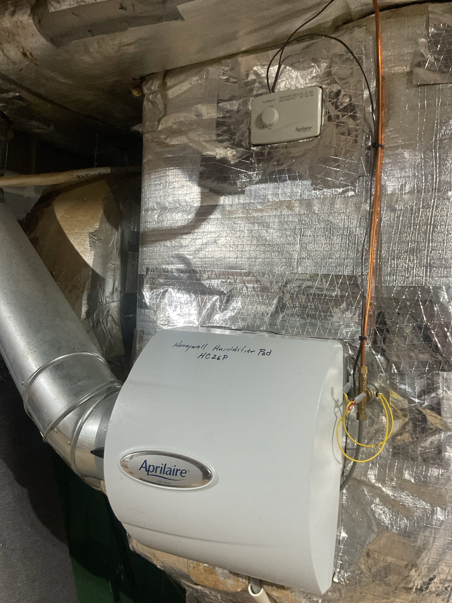 Wrong humidifier pad was installed. It was a moisture wicking style pad.
Consequently the humidifier was leaking.
Offered humidifier service.
Cleaned housing, verified water flow. Installed new Aprilaire 35 water panel.
Humidifier is being fed from the hot water line. We set the humidistat to 46% because he said he struggles to get above low 20s.
Keep an eye on condensation on windows and set humidi target back if you notice it.

Did not charge diagnostic because this service could have been offered at last heat tune up.
I also left estimate for Aprilaire 600 maintenance kit. 

System operating well at this time 