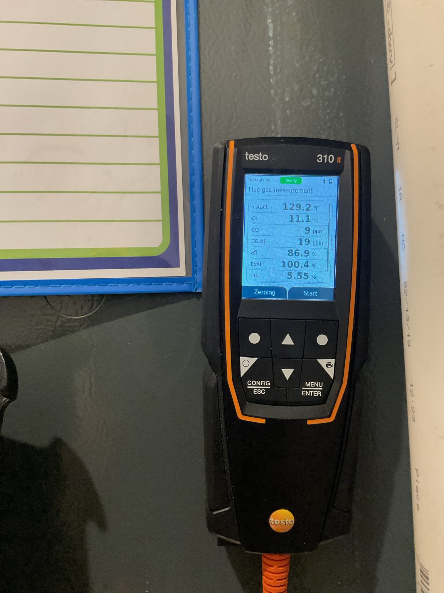 Found auxiliary pan full of water and float switch tripped.
Causing loss of power to thermostat.
The “rain gutter” tube was detached at the inducer exhaust elbow. I reattached.
Removed water from pan (12 gallons)
And then tested for any other sources of water. 

Replaced 16x25x1 filter 
Combustion and draft tests: Pass

Told homeowner to set FAN to “On” at thermostat for a couple days to thoroughly dry the blower compartment. 

Left estimate for wet switch/flood safety. More effective and reliable water safety.
Left estimate for EZ trap for AC drain line, has overfill protection switch,
Also recommend and provided estimate for running condensate vinyl discharge to the available standpipe at water softening system drain. See photos. 

System operating well at this time. 