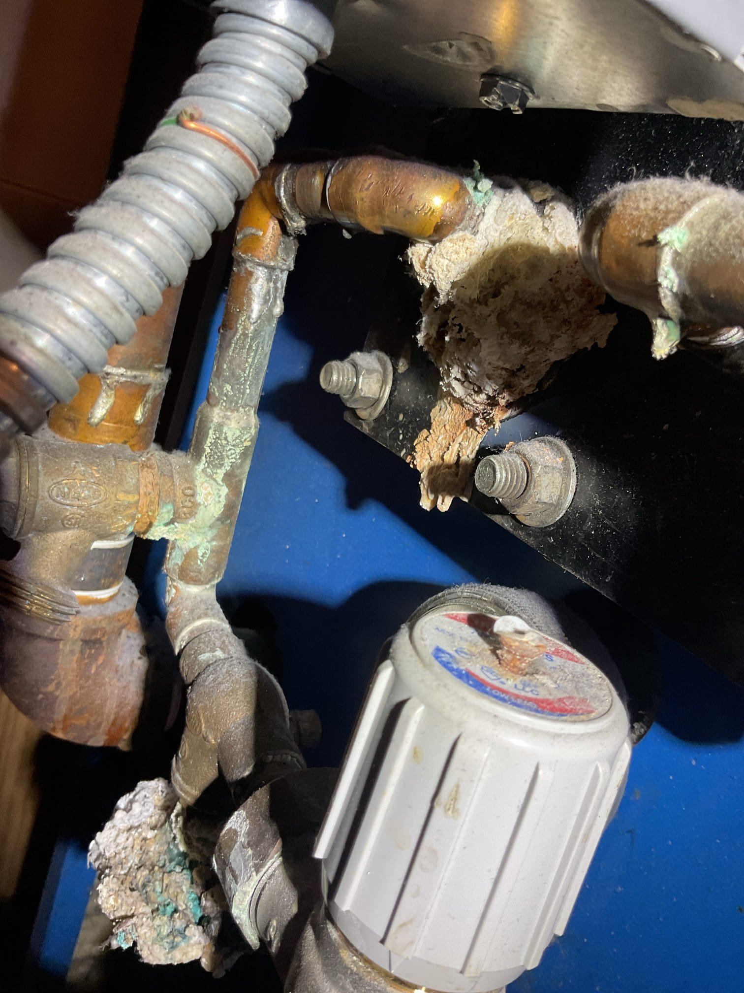 Equipment is oil boiler I believe to be from 1994 based on serial number converted to natural gas. There is a Mitch burner gun with Fenwal control. 
Has Domestic coil. 
6 zones

When I arrived boiler aquastat was satisfied.
He told me the burner control will randomly terminate and display 3 flash.
Although it s a gas boiler it is producing thin layer of black soot.
Heat exchanger needs to be deep cleaned. 
Burner control control also needs to be replaced. The current control is obsolete.
Another tech has removed the heat exchanger baffles during a previous visit.
Took photos. 
System failed combustion test. 
He has Carbon monoxide detectors. 

We will provide estimate for minimal required repairs which is replace burner control and deep clean Heat exchanger. 
Please also provide estimate for the entire gas burner because I did notice the motor making some noise. 
The technician will need a soot vac and correct size brush. See photos. 

Heat exchanger needs to be deep cleaned and contro