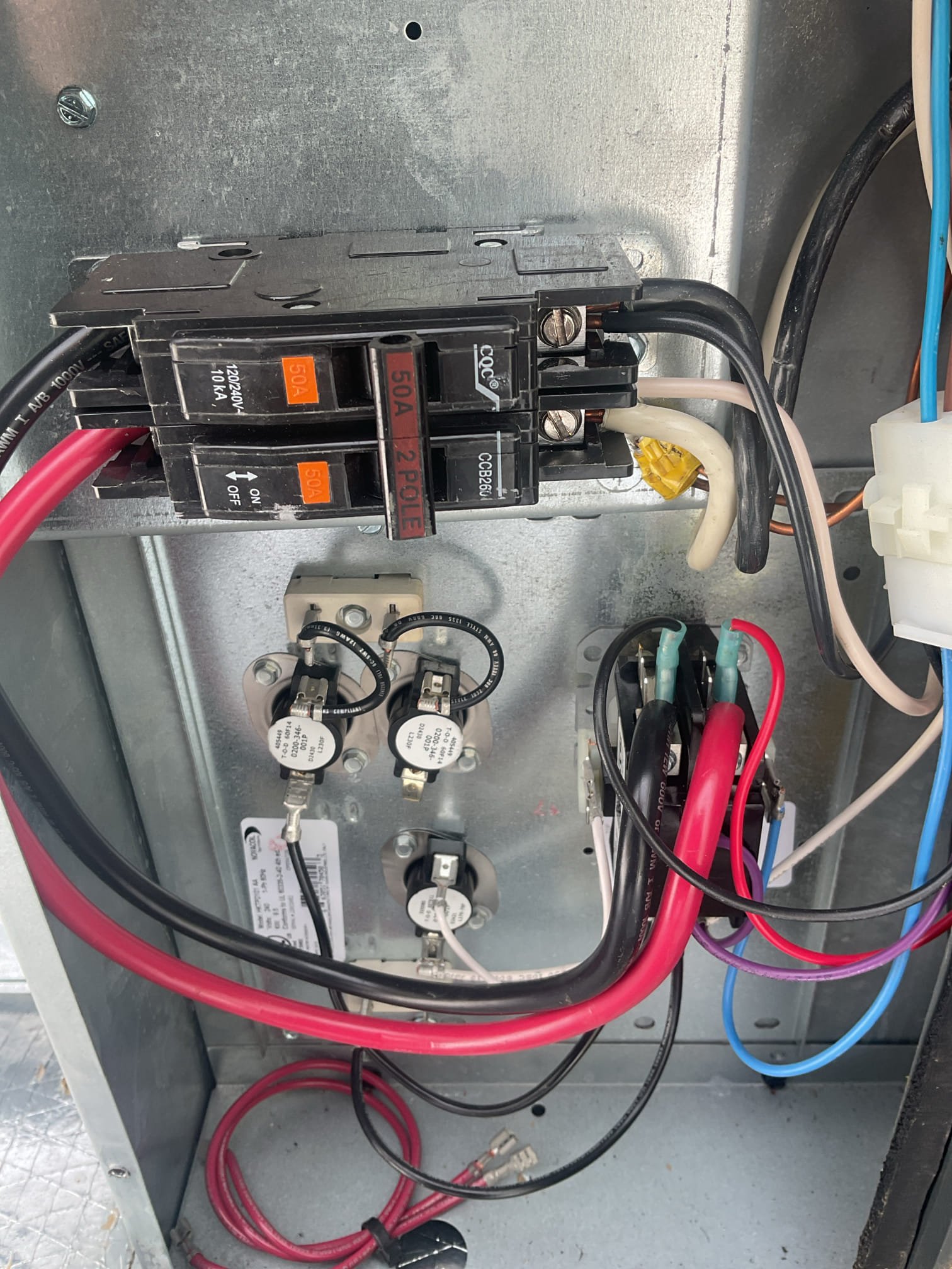 Fully assessed no heating situation. Found compressor running and both fan motors running when I arrived. R-32 refrigerant pressures on 2025 Goodman package unit were 226/57, very good. Home temperature inside was only 54 degrees. Took open panels on system and found 50 amp breaker for strip heater was tripped, checked over all wiring and connections, all looked ok. Reset breaker and tested 5 kw it was 21 amps. Supply temp with kit and compressor running was 91 degrees. Temperature went from 54 degrees to 57 degrees while I was on site. Set thermostat to 65 degrees and told tenets to try to keep it at one set temperature. At this point do not know why breaker had tripped. Goodman package heat pump is working properly at time of service. 