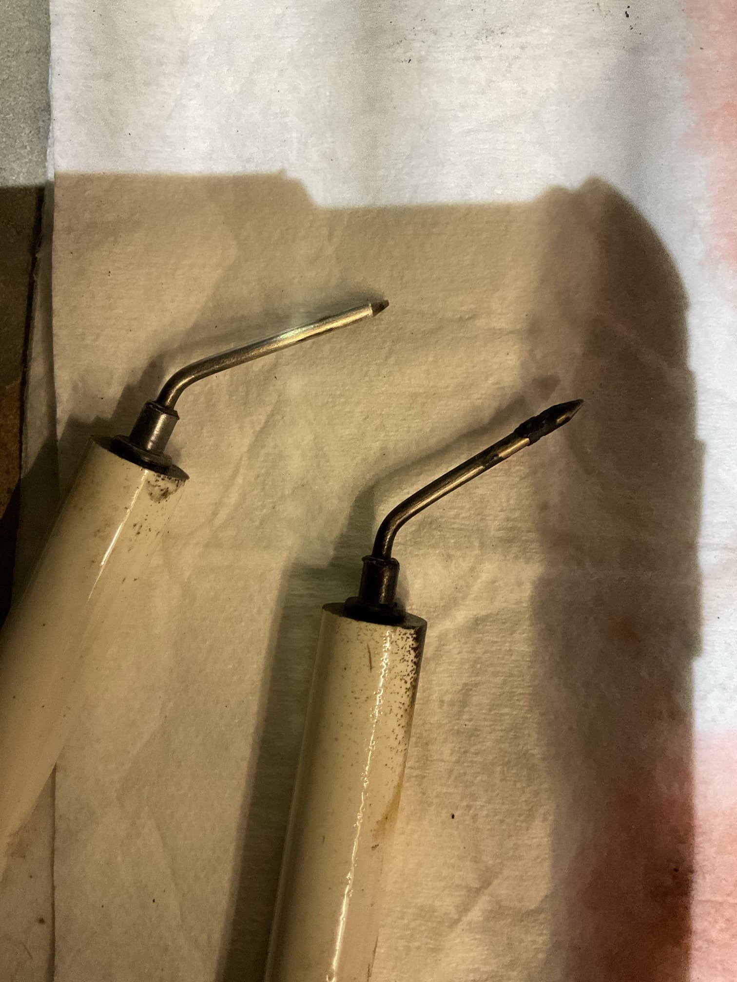 I arrived for a recall on an 22 yr old Dayton oil furnace system. We were here the day before and put a new oil pump on the oil burner. Customer says the heat will run for a few hours, and then he has to reset the oil burner and then it will run for another few and lock out again.  I had carbon build up on the electrodes and in the blast tube. This can happen if the oil is choked off Or not getting to the nozzle enough . I went through the system and made sure the transformer was good, system does have oil , and the pump after is moving oil . I removed my nozzle assembly and ran oil through it with it connected to my pump and pointed into a bucket. When the burner got a call for oil nothing came out. I even removed the strainer and added another still no oil through the nozzle. I cleaned out my assembly and ran out and purchased a new nozzle. Before putting the new nozzle in, I turned the furnace back on and tested the nozzle assembly without a nozzle in it and oil did flow through it 