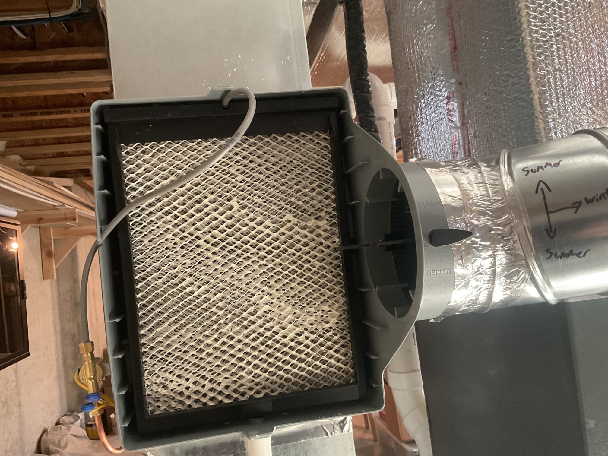 Fully assessed humidifier not humidifying as well as it should. Found winter summer damper not open all the way. Showed Kate how to open all the way. Also found humidifier pad full of calcium and debris and needed serviced anyway. Serviced humidifier with #35 pad and flushed out drain. Tested humidifier operation. Humidifier is working properly at time of service. 