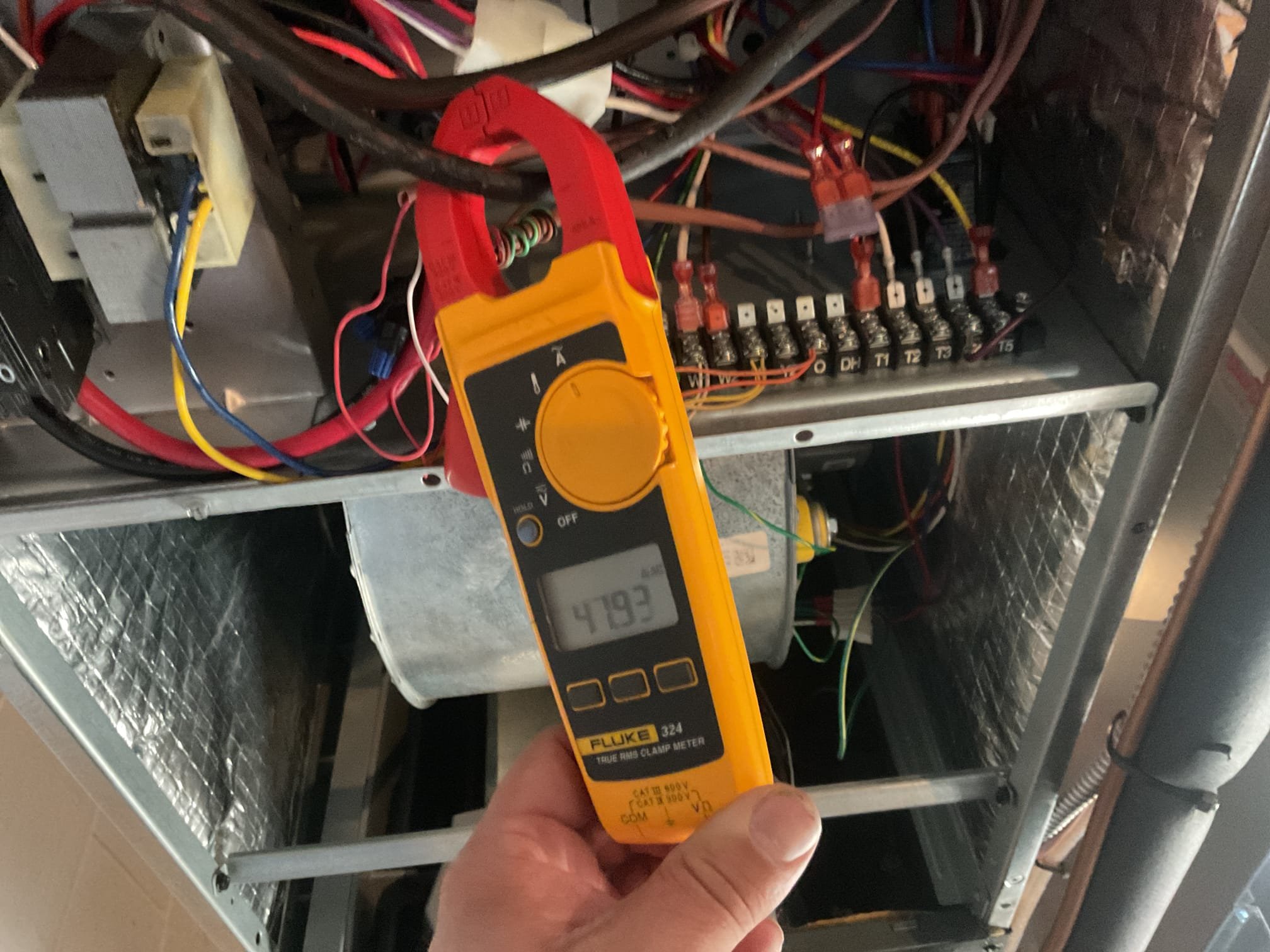 Fully assessed burning smell situation on Goodman heat pump system ( installed by another contractor). Ran system in heat pump mode only and went outside to outside heat pump to check 410a refrigerant pressures at 16 degrees f. Pressures were 225/64. Temperatures rise at air handler was only 14 degrees. ( cold outside temp is effecting temperature rise). Then checked out auxiliary heat operations. Found auxiliary heat worked drawling 41 amps, but found wiring feeding it and 40 amp contactor were burnt. Connections to auxiliary heat breaker were not very tight. Provided estimate to repair wiring and replace 40 amp double pole breaker. Customer agreed and also signed up for maintenance plan. Also waived ($99) diagnostic per management. Also made adjustments to thermostat per auxiliary heat. Changed settings from factory 2.9 to 2.0 Fahrenheit. Heat pump is working properly at time of service. 