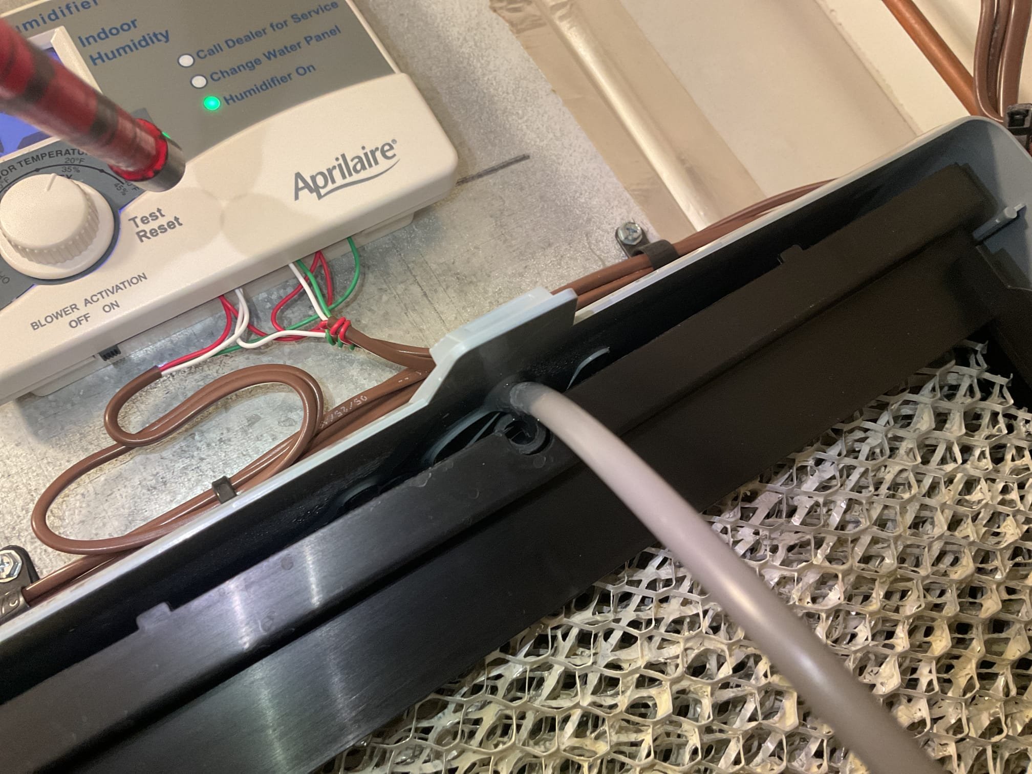 Fully assessed water leaking situation on humidifier. Opened up humidifier and found feed tube was not installed correctly by homeowner it was over top of the humidifier tray. Showed homeowner this and installed correctly. Took static pressure readings when only the top floor zone was calling. Return after the filter static and before the coil was 1.7. Over all static was 1.3 w.c.. made adjustments in cool cloud from from 83% on high stage to 81%. Also adjusted trim from zero to -4%. This is as low as the high stage can be adjusted. Talked to management about possibly of using a pressure switch to open up the solenoid when the static becomes to high. Our office to provide a solution. Customer is not happy at this time and wanted the humidifier issue resolved today. 