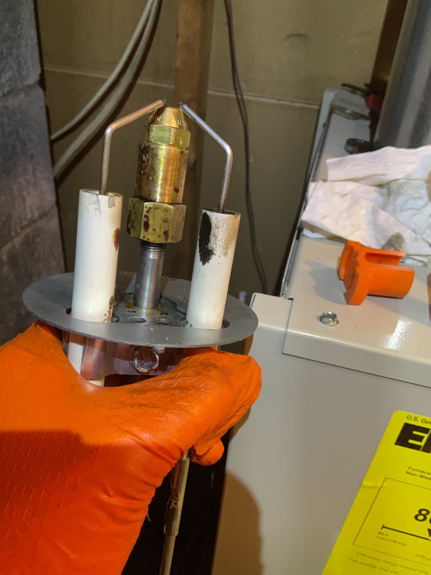 I arrived to the customers house for no on a newly installed oil burner furnace was in March 2025. I did find that customer was getting low on fuel. He has a refill on February 1. I looked inside the tank. He does have enough fuel at this time, but the real issue was wasn’t getting through and out of the nozzle. I did check my oil, flow oil filter and strainer. I had good flow coming from the pump. I removed my nozzle gun and my nozzle and electrodes had solid carbon on it and in the blast tube. This would prevent the furnace from firing off. I went through the system and replaced the nozzle .50x80A and cleaned the electrodes, and cleared the nozzle gun with cleaner and a piece of wire. I set my nozzle assembly with my z gauge and adjusted my pump pressure was at 130 set back to 120 psi from system specs. No charge for today’s service warranty. Customer is aware that if it does run out or it gets air locked from the fill it can be chargeable for to bleed and prime. 