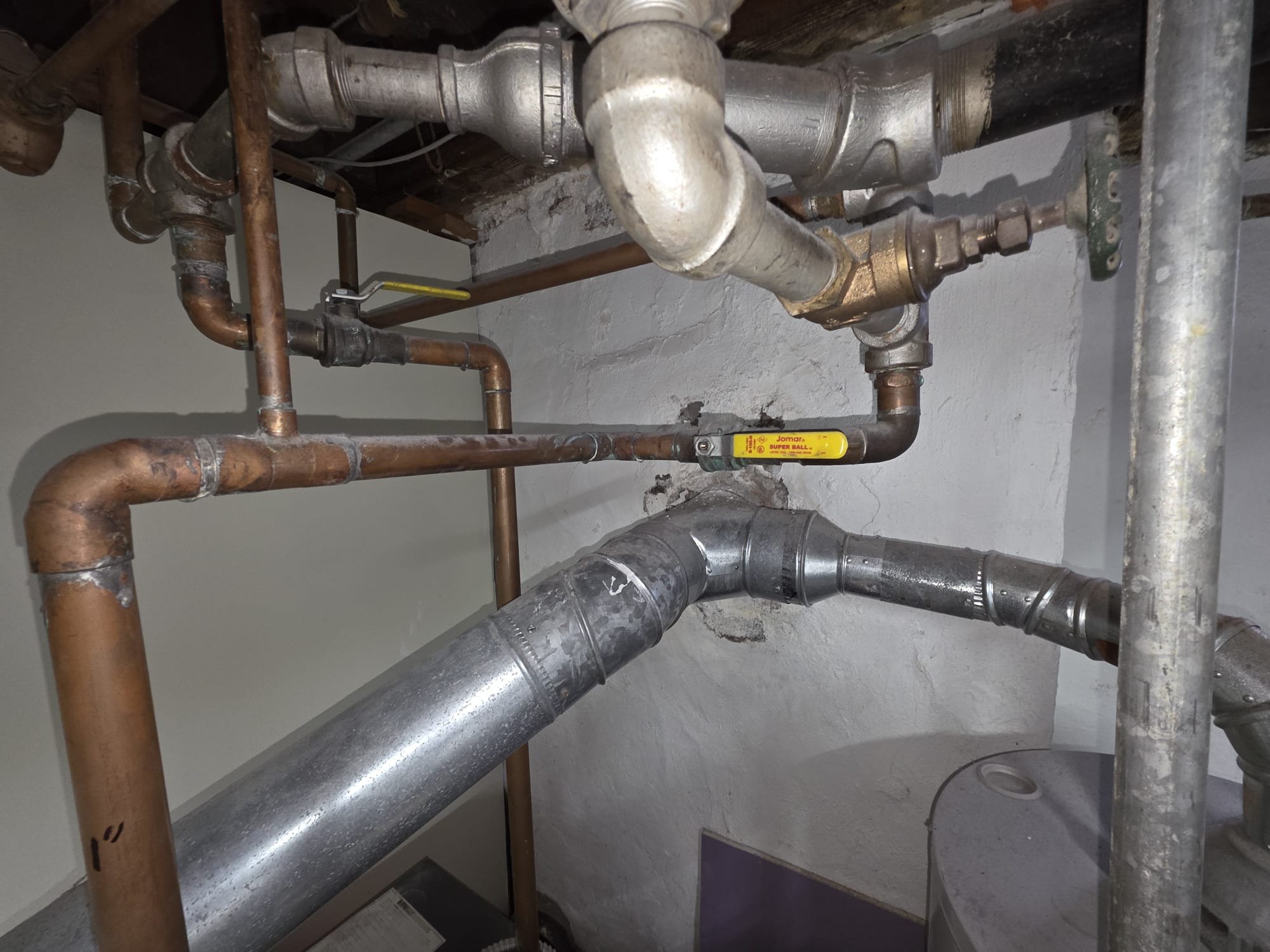 Inspected boiler and found boiler has not been serviced in some time.  Removed inspection plates and cleaned between sections.  Removed and cleaned burners.  There was heavy corrosion and rust.  Replaced fusible link with 149 degc link which was much lower than the original limit.  Put boiler back together and fired.  Gathered information for replacement.  Performed combustion analysis and draft test and monitored operation.  