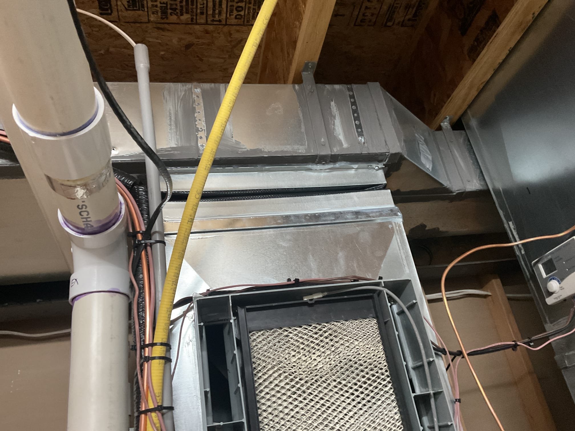 Performed quality assurance on recently installed high efficiency Goodman gas furnace and a/c. Customer pointed out that there were pipe hangers left hanging on the ductwork and duct work was not properly sealed. Removed old hangers and sealed joints with silicone supply and return. Also customer pointed out there was a black spot on the concrete in basement left by installers. Cleaned up. Checked over install. Performed combustion test. Gas furnace is working properly at time of service. 