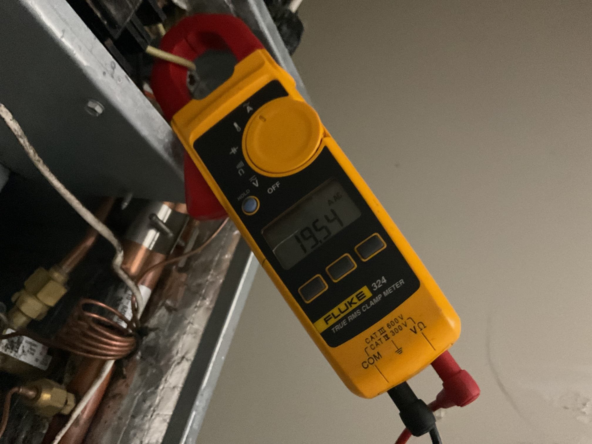 Fully assessed no heating situation. Found breakers off when I arrived. Turned on breakers and tested out system. Found emergency heat did come on and it was drawing 19.65 A working correctly. Found that heat pump did not come on. Found thermostat was configured and set up as conventional not heat pump. Flip switch on back a thermostat and check settings. Tested out heat pump system on the roof. 410a pressures were 245/87. Temperature rise was 20 degrees. Heat pump system is working properly at time of service. 