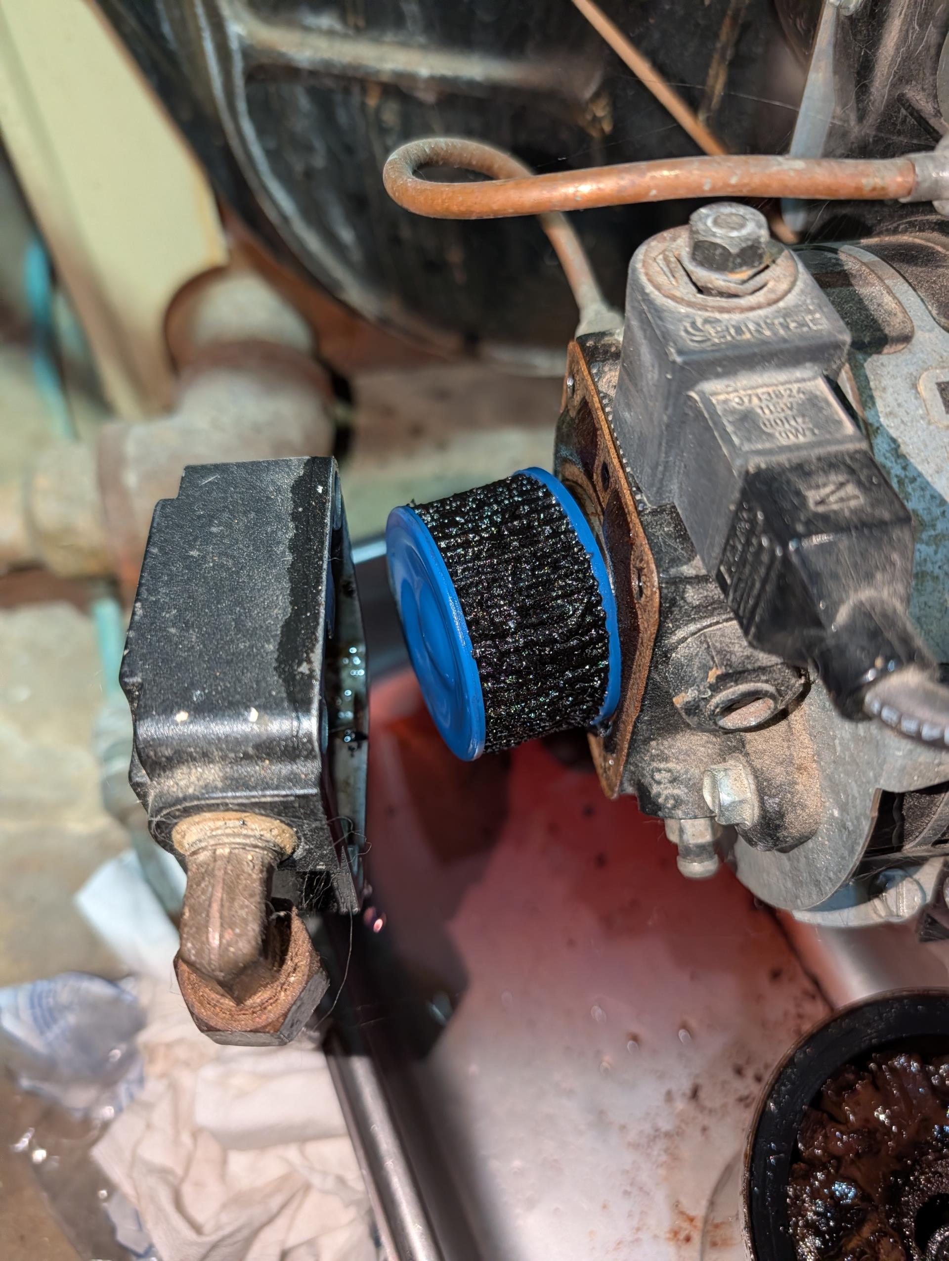 Completed heat tune up for Weil McClain Gold oil boiler 

There was oil when I wiped bottom of oil filter canister. I brought rhis to homeowners attention and offered to replace the oil filter canister. He agreed, 
Cleaned heat exchanger and inspected flue piping and chimney. Heat exchanger has a cleaning brush stuck in flue passageway This isn’t a major concern but brought it to homeowners attention. This happened with previous company/technician. 
Replaced oil filter, strainer with gasket and nozzle. All in very bad condition.
Inspected electrode condition and alignment, transformer, cad cell eye, and air bands for debris. Electrodes may need to be replaced in upcoming maintenance visits. Provide email estimate to replace when needed,
Inspected wiring, controls, electric motors and components. 
Provided estimate for water leak sensor to be installed around boiler.
Bled oil line and tested system. Took some time to bleed oil line. Tank is 3/4 full. 

As a reminder there is no control 