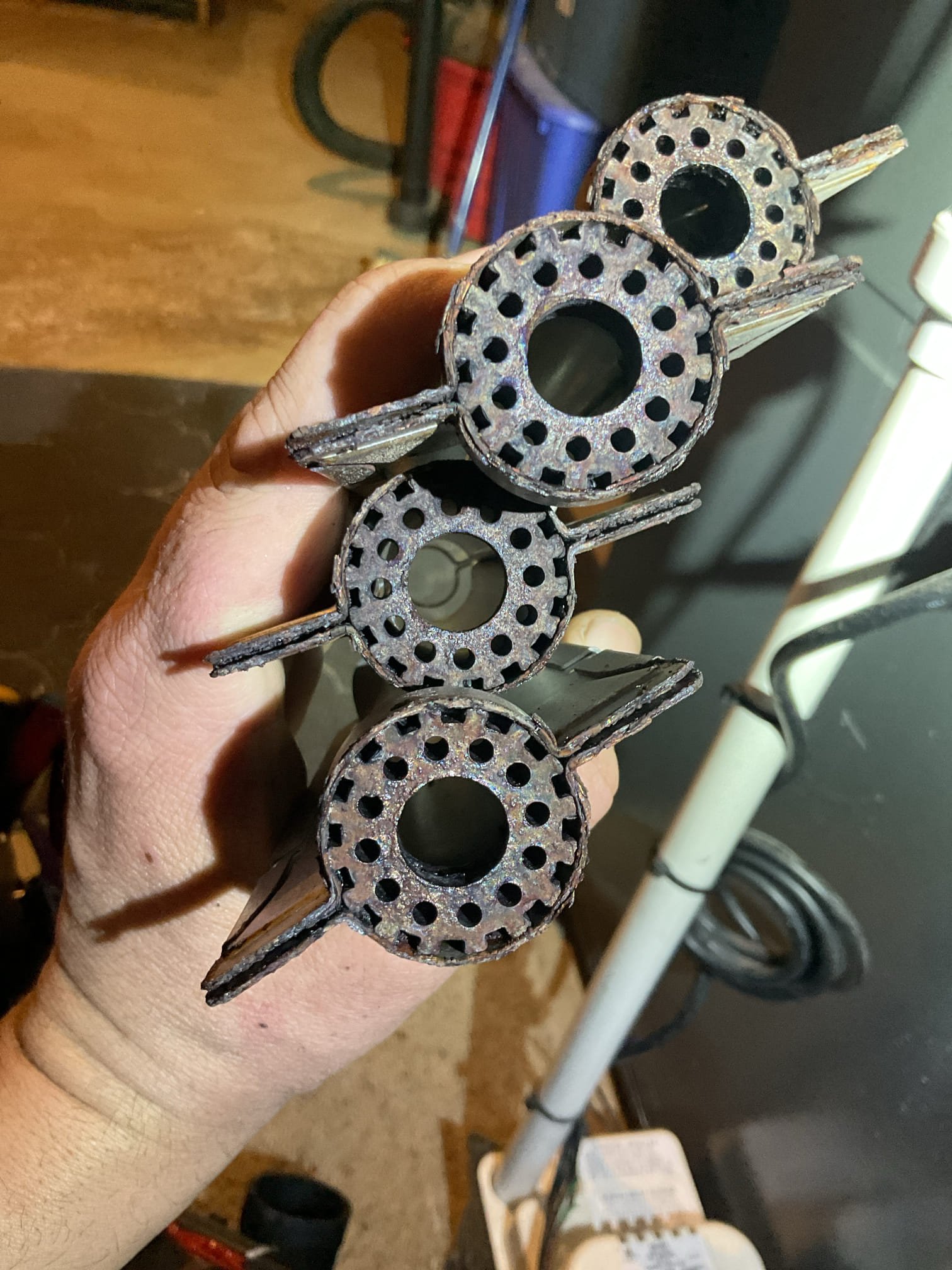 Found silicone bands around inducer had broken free and got stuck between inducer frame and squirrel cage rotor thereby causing the inducer to be seized stuck.
I removed the bands as necessary to allow rotor to spin for now. Inducer needs to be replaced under parts only warranty.

After addressing this issue the trial for ignition stopped at light off of burners due to severe corrosion of burners. Propane is not able to pass through crossover pers of burners to to accumulation of rust. I cleaned burners as best as possible. At the time we made proposal for this furnace the manufacturer did NOT offer stainless steel burners. Now stainless steel burners are available strongly recommend replacing corroded burners with stainless steel. 

Offered to replace inducer under parts warranty and upgrade burners to stainless steel today. 
Homeowners agreed.

Ordered and picked up parts from supply house.
Removed failed inducer and installed new. 
Replaced aluminized steel burners with new stainles