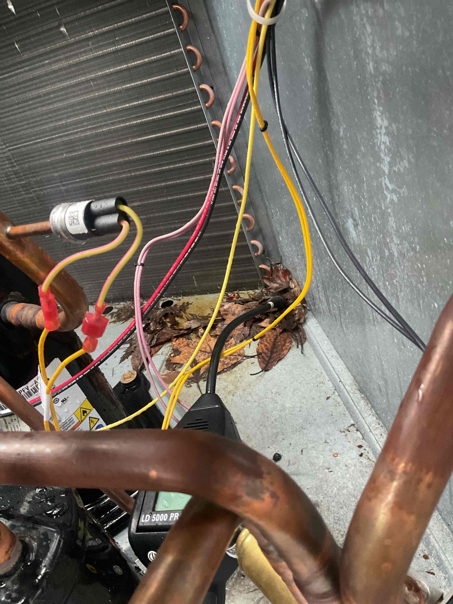 Kicked on package unit in heat pump mode , r-32 refrigerant pressures were 229/35, low on charge. Performed leak search on system with electronic leak detector and found outside coil is leaking. Our office to look into availability of coil and will get back to customer as soon as possible. System is running on auxiliary heat at this time.