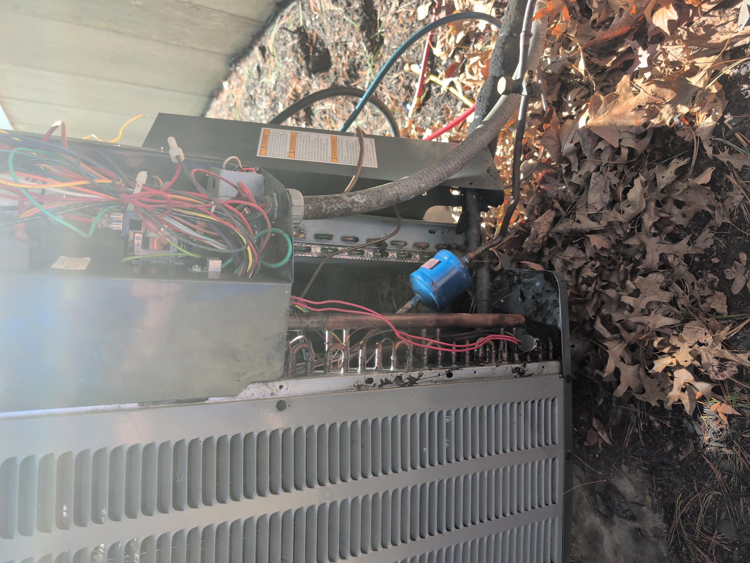 Replace indoor coil under part warranty (Non-warranty price for repair is $3624.40)

           *  Recover remaining refrigerant.
           *  Remove and replace indoor coil with warranty coil.
           *  Complete all mechanical connections to coil.
           *  Pressure test system and soap test joints for leaks.
           *  Evacuate system to below 500 microns.
           *  Weigh in factory refrigerant charge.
           *  Test system operation 
           *  Adjust charge by adding refrigerant as needed.
           *  Process warranty with distributor for credit fort new coil.

3/10/26
Released remaining nitrogen in system.
Removed failed leaking indoor coil 
Installed TXV in new coil and placed back on original drain pan.
Brazed in new indoor coil
*Also Removed filter drier and installed 3/8 refrigerant copper in its place. Installed new filter drier at more accessible location outside unit.

Afterwards pressure tested with dry nitrogen to 345 psi and I could heat hissing 