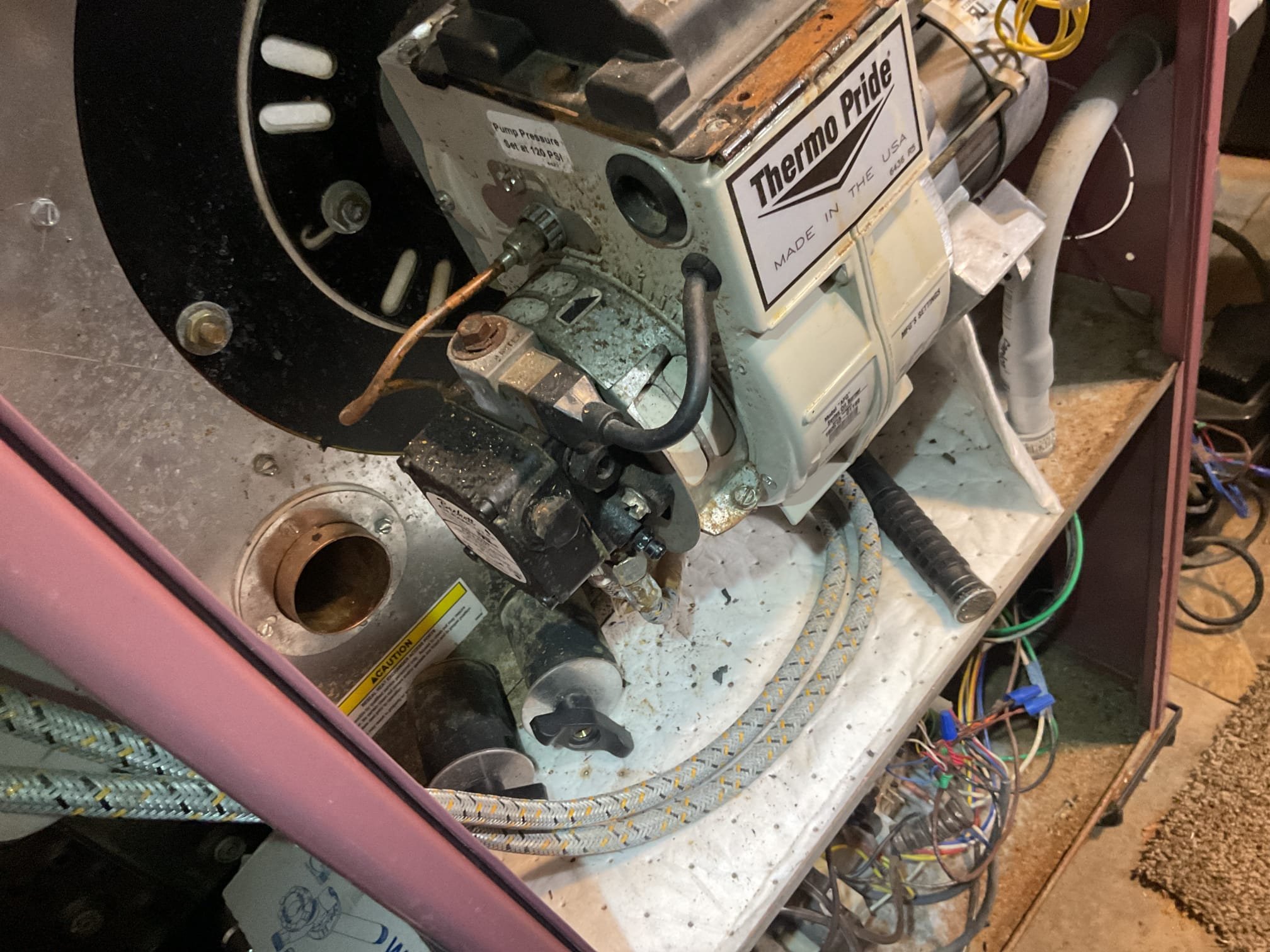 Luis 3-18-26 performed oil heater tune up on 10 year old thermopride oil heater. Test system operation ok. Inspect burner assembly, air delivery (customer uses washable filter, electronic filter not working) and oil delivery system. Change nozzle and pump strainer, oil filter ok at this time. Clean and adjust electrodes. Remove flue pipe and inspect chimney base, clean heat exchanger ok performed combustion test ok. Check electrical system low and high (unit does not have surge protection) Cycle oil heater ok. During today’s visit I noticed some items that will need attention, condensation pump and vinyl should get replaced to prevent any water leaks. Humidifier is not connected looks to be in bad shape, adding humidifier to system will improve comfort and more evenly temperatures around the house. Some of burner components are starting to show corrosion still functioning, we will monitor this parts over next heat tune up. (Flue pipe and high voltage transformer). 