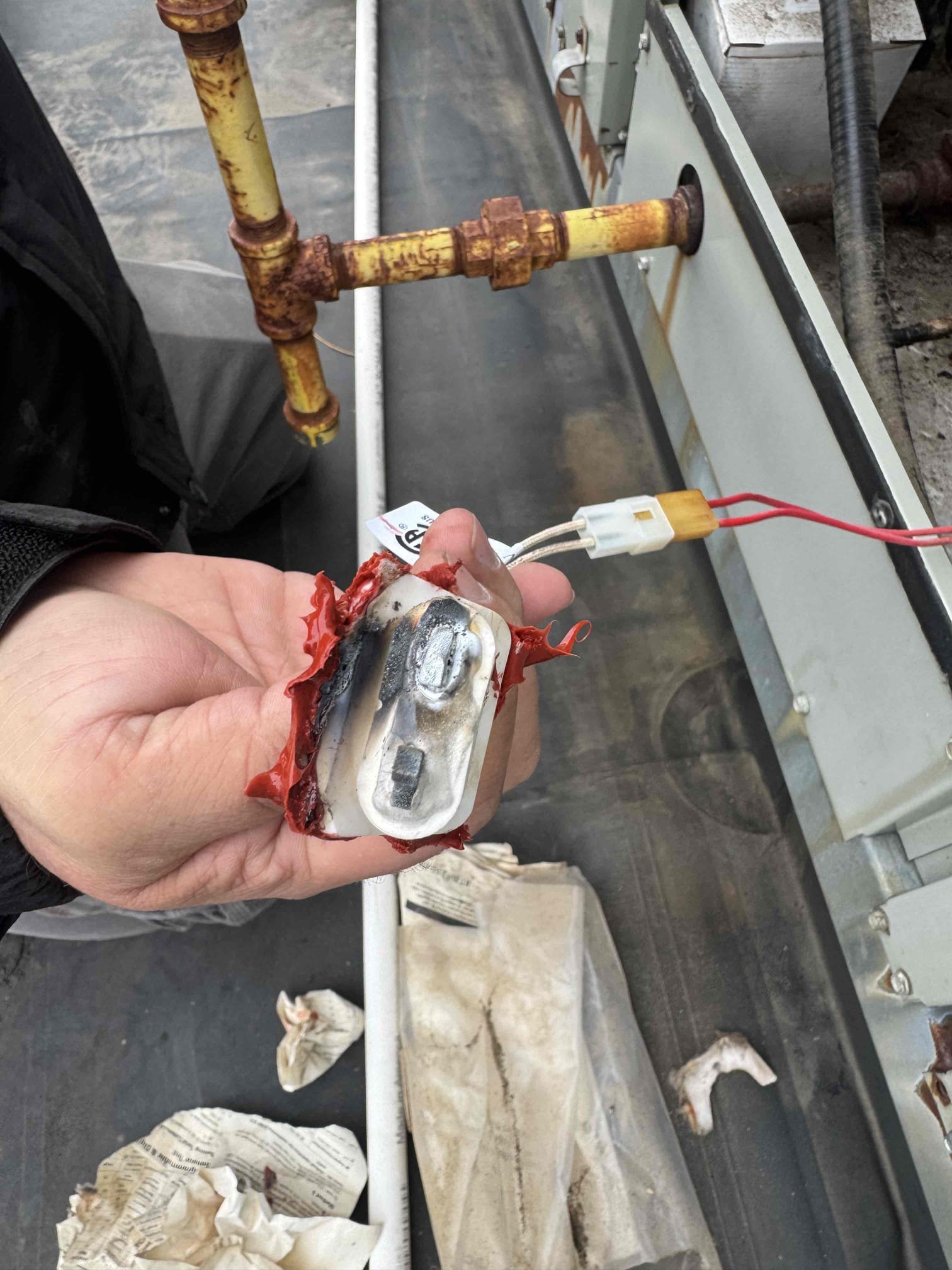 3/19/26.
 Removed old igniter and put new igniter in its place. Found that after installing the new igniter and cycling on gas furnace smoke started to come from bottom of roof top. Found that where the igniter goes in that the metal was disformed from heat at the heat exchanger so much that the new igniter could not make a good seal. Firberglass gasket started to burn and smoke was coming out at the supply. This is not repairable. Recommend replacement of roof top system. Talked to Charlene about situation. 
