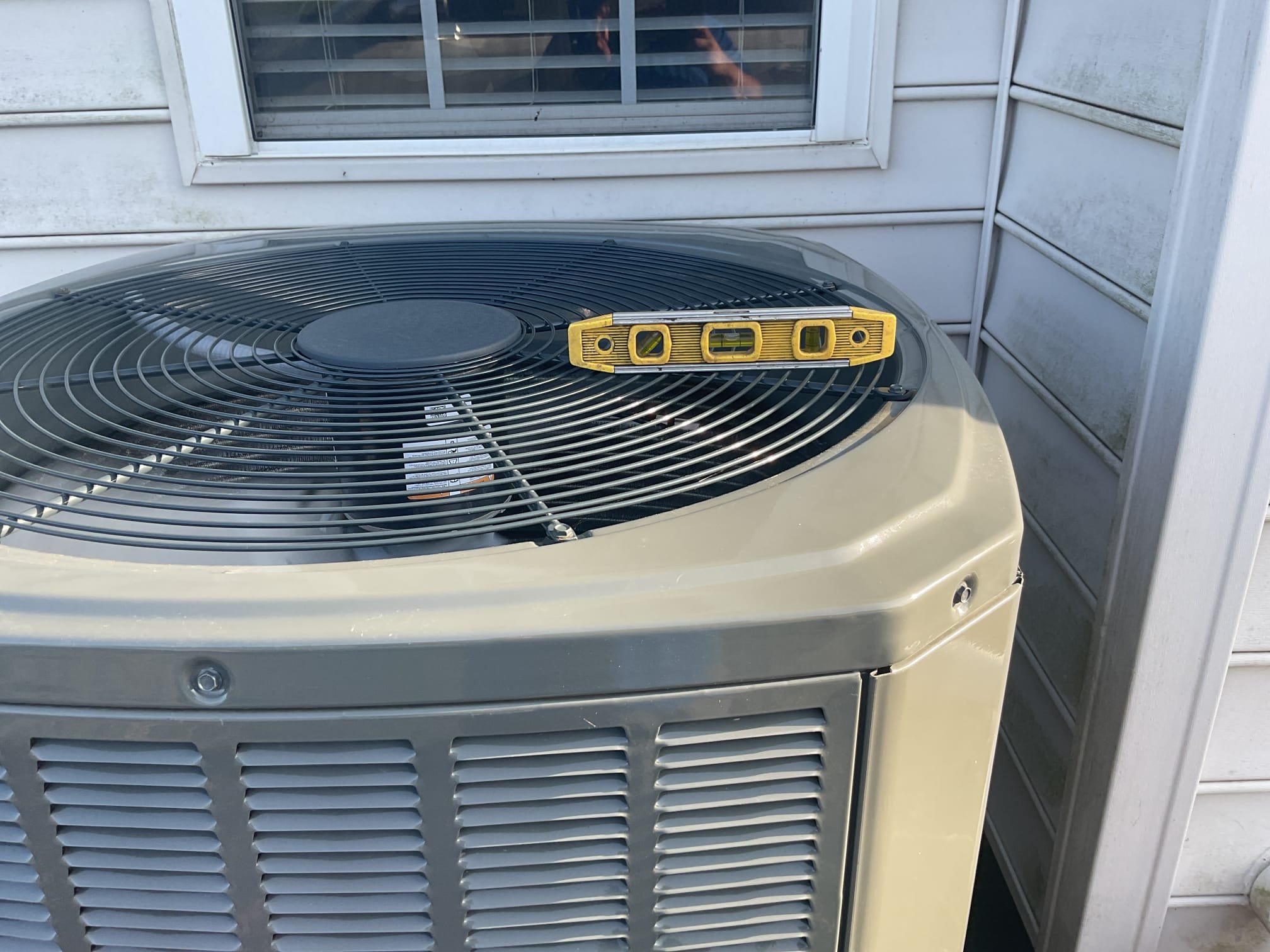 4/1/26. Found unit became slightly off level. Relevel unit using existing ground. Checked all 4 sides. Unit is now level. Also tightened all the screws he mentioned that they were hearing a rattling noise. Heat pump is working properly at time of service. 