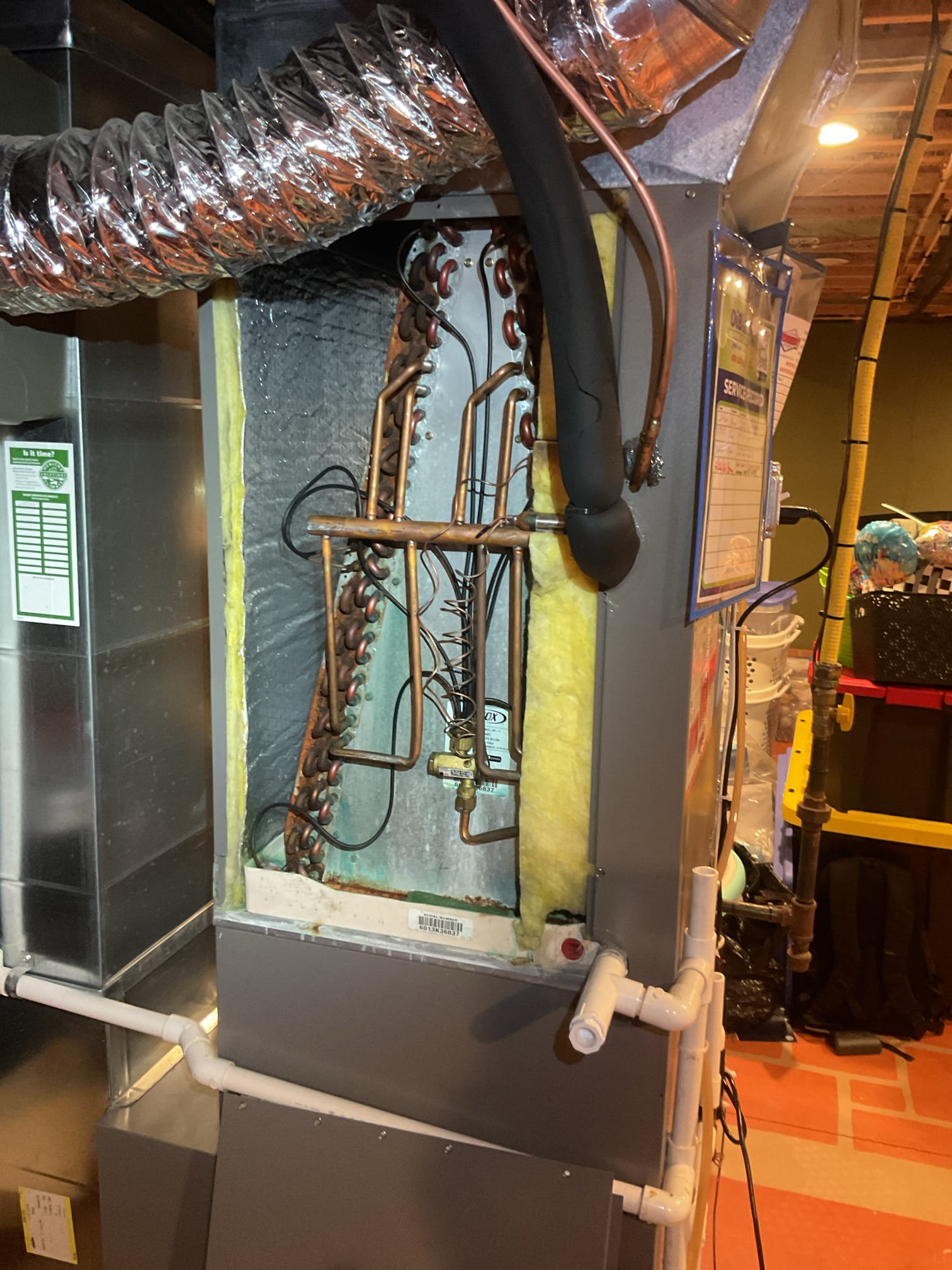 Completed AC tune up for 5 Ton Lennox heat pump system. Equipment is propane furnace/heat pump hybrid 
System is 12 years old. 

Filter Replaced in February; in good condition 
Indoor coil had refrigerant oil on the top right side. Conducted electronic leak search and found leak at top of A coil. Showed homeowner video of this. 
Inspected wiring, controls, electric motors and components; left estimates for surge protectors 
Measured temperature split and static pressure 
Inspected drains; drain, tested pump; added treatment tabs to pump. Left previous estimate to replace pump and tubing. 
Checked integrity of compressor motor (mega ohm test)

Assessed refrigerant charge checked pressures. 2.8° Subcooling. Refrigerant pressures and date indicate and undercharge which correlates to finding leak at indoor coil. 

Provided 2 estimates
1. Charge system up to 2# R410A refrigerant. There is no guarantee how long refrigerant will last considering leak.
2. Replace indoor coil. This is also not 