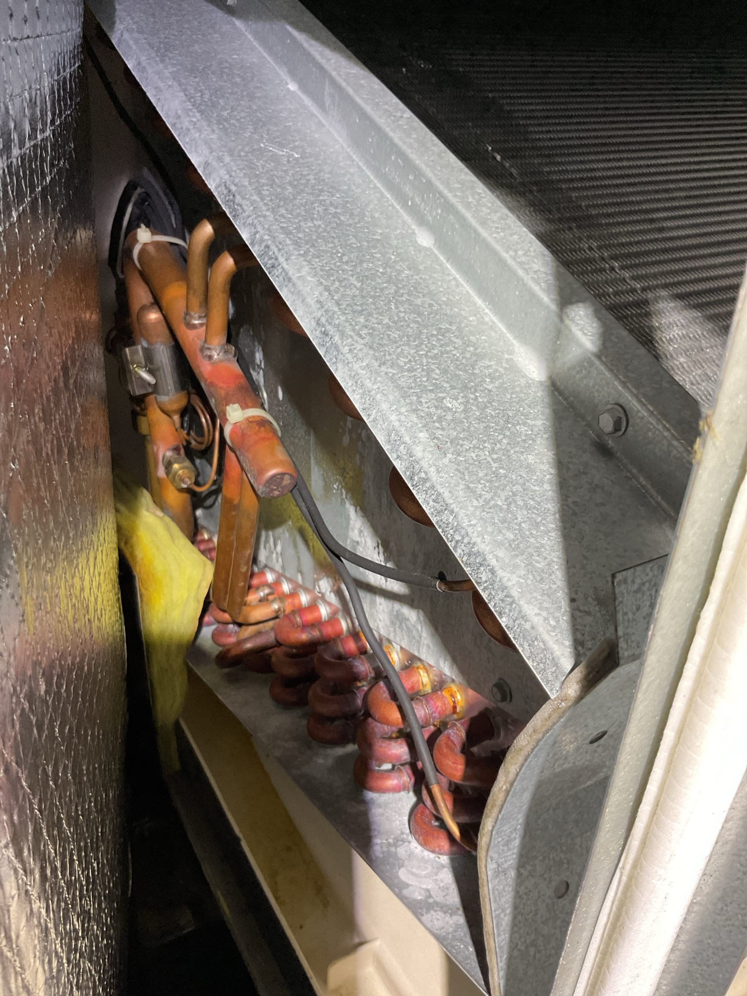 Completed (2) AC tune ups both systems are heat pumps with electric back up.

2 Ton Lennox Heat pump for family room system. Air handler located above garage, 13 years old 
3 Ton Trane system air handler in basement, 18 years old

Replaced 20x20x4 filter at attic air handler provided by homeowner 
20x20x1 filter at basement system ok. 

For attic system:
Inspected indoor and outdoor coils: Ok
Inspected wiring, controls, electric motors and components; left estimates for surge protector for outdoor unit 
Measured temperature split (67-45) and static pressure 
Inspected drains; clears EZ trap and flushed with 3 quarts water,
Checked integrity of compressor motor (mega ohm test)
Assessed refrigerant charge checked pressures. Slightly high superheat good subcooling. 
AC system operating ok at this time. 

For 3 Ton Trane system

Outdoor coil has rust as to be expected for system of its age 18 years. Outdoor coil ok.
Completed AC tune up for 3 Ton Amana AC system
Inspected wiring, controls,