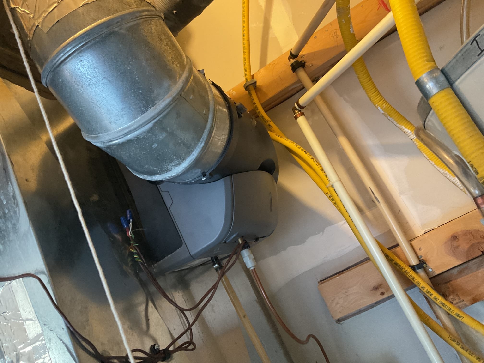 4/8/26. Fully assessed water leaking situation. Found that the water was not coming from the water heater it was coming from the Exsisting Honeywell humidifier. Opened up humidifier and found #10 pad all clogged up. Recommend that we service the humidifier. Replaced existing pad and Wipped out inside of humidifier housing. Blew out drain line. Turned back on humidifier and set to 35%. Humidifier is working properly at time of service. 