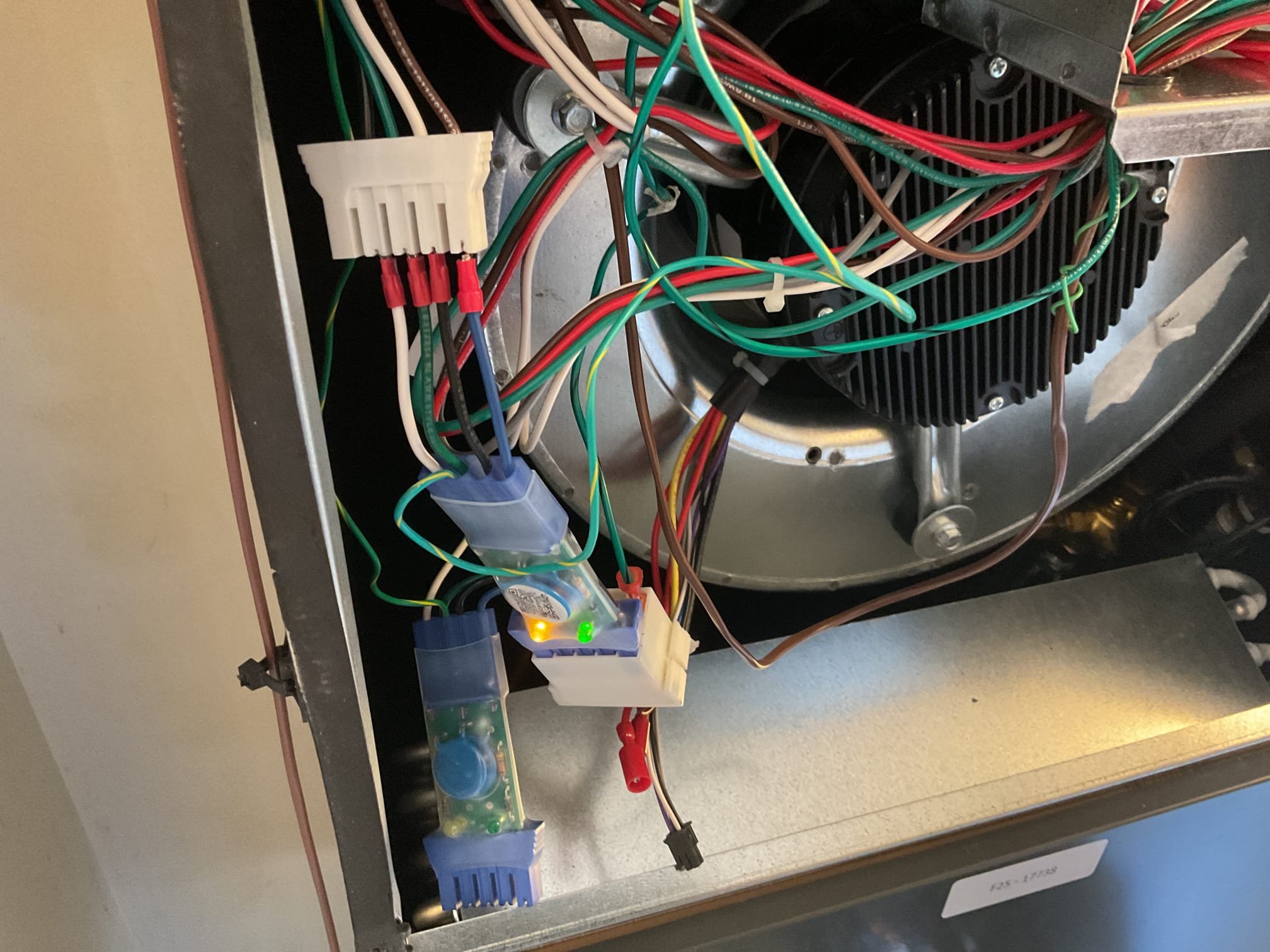 4/9/26. Found air handler very loud when I arrived and not moving much air flow on 2025 trane heat pump system. Found x13 surge protector only lite up with (1) led instead of 2 indicating 120 v instead of 240 v. Swapped out x13 surge protector only lite and now both lights are light up and there is 240 v going to the Ecm motor. This is a single speed tap x 13 blower motor. Found blower motor running very slow and hooked up gauges 454b pressure was 543/113 going off on high pressure. Tried adjusting speed taps motor would not pick up speed and run. Ecm blower motor has failed need to order and replace fan motor under warranty.  Customer has no heat and is going to use space heaters.