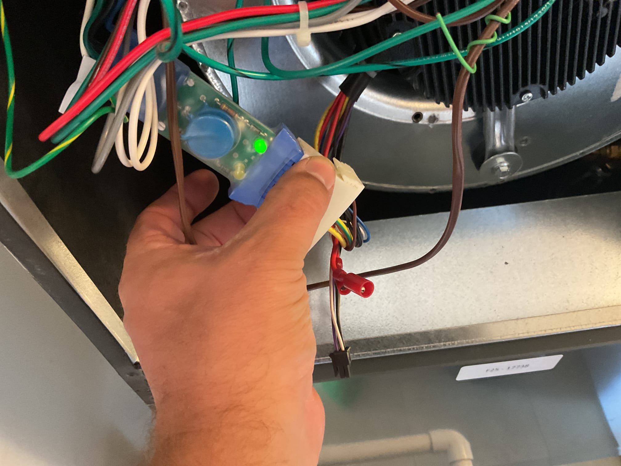 4/9/26. Found air handler very loud when I arrived and not moving much air flow on 2025 trane heat pump system. Found x13 surge protector only lite up with (1) led instead of 2 indicating 120 v instead of 240 v. Swapped out x13 surge protector only lite and now both lights are light up and there is 240 v going to the Ecm motor. This is a single speed tap x 13 blower motor. Found blower motor running very slow and hooked up gauges 454b pressure was 543/113 going off on high pressure. Tried adjusting speed taps motor would not pick up speed and run. Ecm blower motor has failed need to order and replace fan motor under warranty.  Customer has no heat and is going to use space heaters.