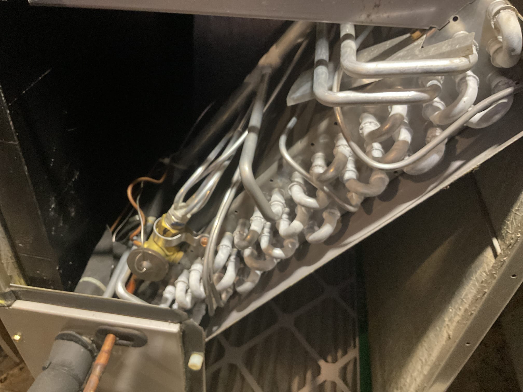 4/9/26. Cut out section of 7/8” copper with hole. Sweat in 7/8” coupler in its place. Pressure tested at 300 psi nitrogen and soap checked. No leaks found. Vacuumed down system to 284 microns. Added 12 lbs r410a. Tested out heat pump in cooling and heating mode. Also performed a/c tune up. Air filter is clean. Checked all electrical connections and components. Checked temperature split. Checked refrigerant pressures and temperatures. Flushed out condensation drain with water. Heat pump is working properly at time of service. 