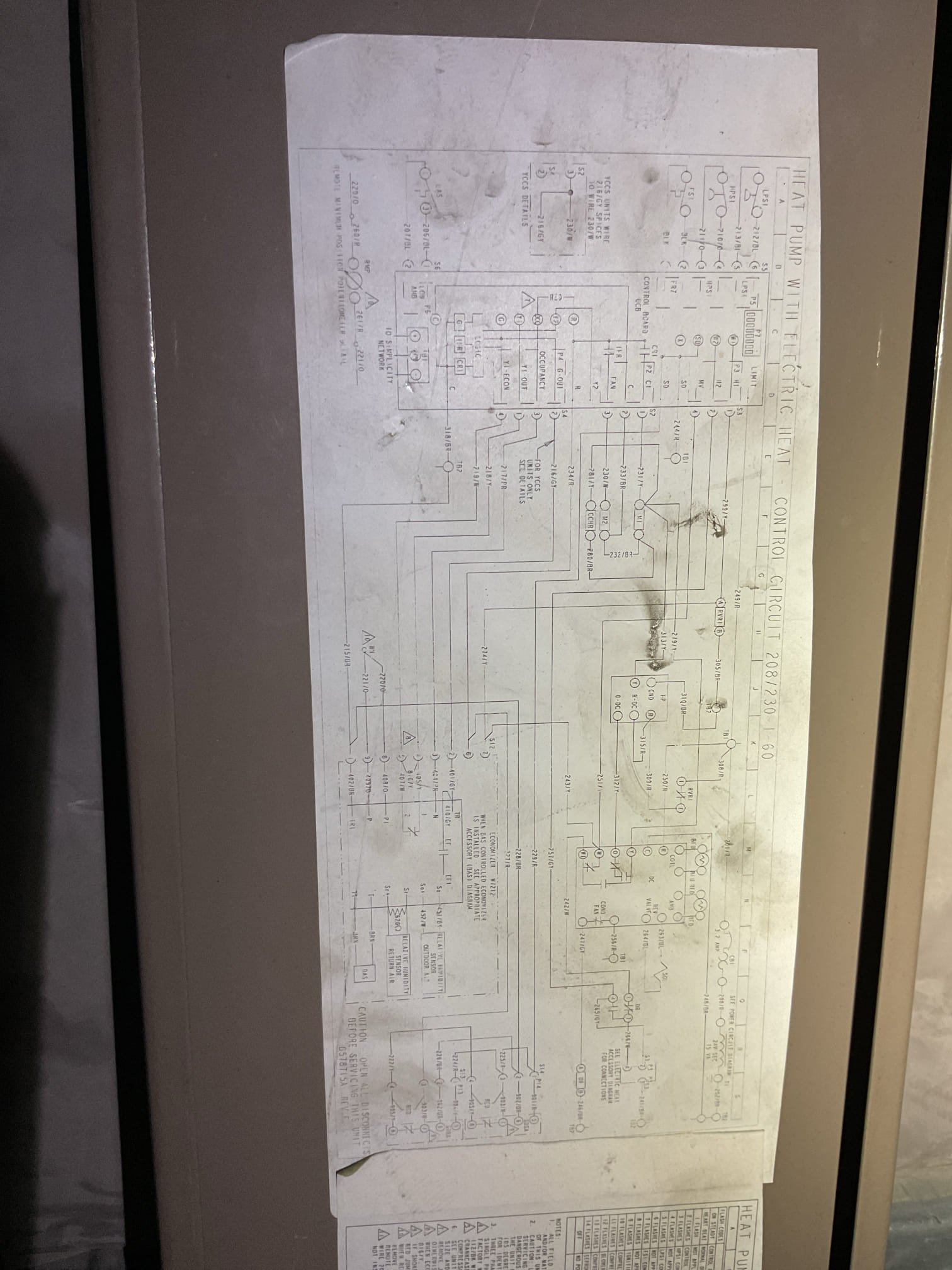 (2) Rooftop units York Heat pumps
Unit 2 works (serves the storefront)

Unit (1) which serves the work area and cashier not running.

Found the 75VA transformer miswired in Such a way that the high voltage contacts were landed on the low voltage points and vice versa! I believe this happened because someone untrained literally wired the transformer based on the colors of the wires. 
Unit yellow (one leg of 240) as wired to transformer Yellow  (24V secondary) 
Unit Black (the other leg of 240v) was wired to transformer Black (primary 120V) 
The unit 24V (resettable fuse) was wired to transformer red (primary 208) 
Unit common (brown) was left unwired as was transformer 24V common. 
*Also noticed a clipped off low voltage wire on roof just outside unit.

At some point the low voltage controls were powered by one leg of 208 volts. 

I rewired the transformer correctly for sake of troubleshooting. Controls are not energizing contactor. The defrost board not passing 24V to contactor. 
We wi