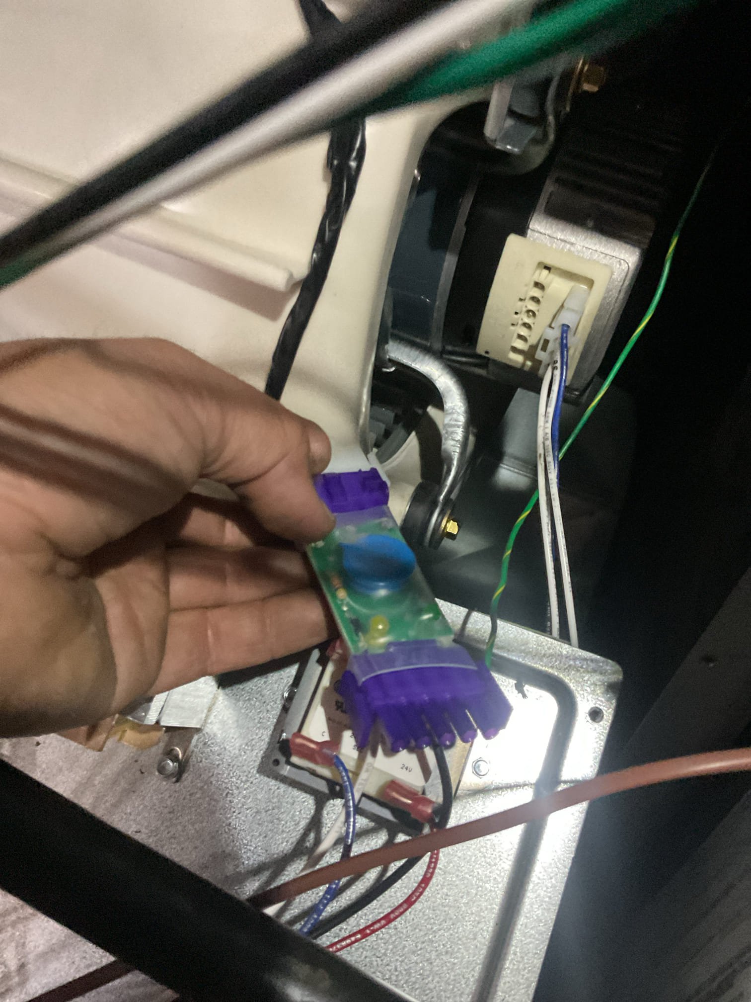 Issue is a “burning smell” 
To me it smells something like burnt candles.
Humidity in basement is also high, smell is more pronounced in the basement itself. 
The plug in dehumidifier may not be working. He will allow it to run and see if it fills the bucket. 

I opened blower compartment of furnace and inspected blower motor, surge protector and harness. No burning smells or indication of overheating.
Also opened high voltage junction box and receptacle and switch. No burned components or overheated wires. Checked the Arzel panel as well. No odors or overheated wires.

There is a hybrid water heater. Filter was a little dirty. We cleaned and put back and opened hot water faucets to get water heater to run. Also checked all wiring connections there. 
To me there is a slight odor on the discharge of water heater. The compressor of the water heater also sounds abnormal/noisy.

The odor is not coming from HVAC equipment. I believe it’s related to humidity in basement. 
