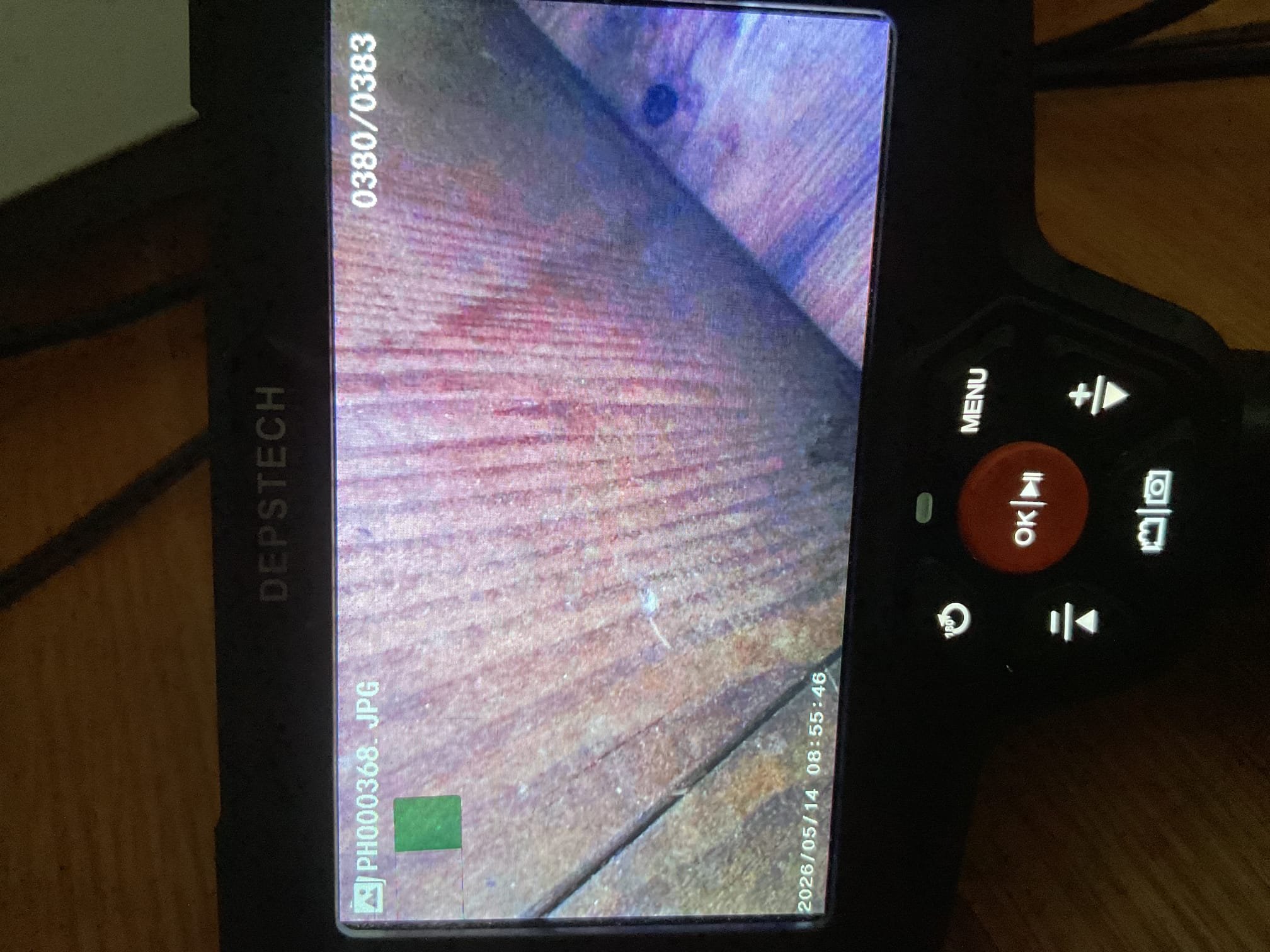 Issue is dark color stains on white siding back side of house around deck.

Roofers, plumbers and a wildlife control person have t been able to pinpoint scat cause.

I checked attic air handler. No signs of water leaks and the drain runs perpendicular to the side of house with Lineset. 

Used inspection camera and popped piece of soffit off that the wildlife company did and noticed that the water leak marks are coming from the piece of wood that the gutters mounted towards the wall NOT from direct,y above. I located the piece section of hydronic baseboard immediately above where these water marks are and scoped between two bedroom walls where 3/4” copper for baseboard runs and connects the 2 sections. No water leaks at all.

I also checked boiler pressure 

I believe the gutters and the wood they are mounted to are the culprit. 
If gutters get loaded with snow and freeze as happened this past winter AND the wood they are mounted to is slightly rotted, the gutters can detach slightly le