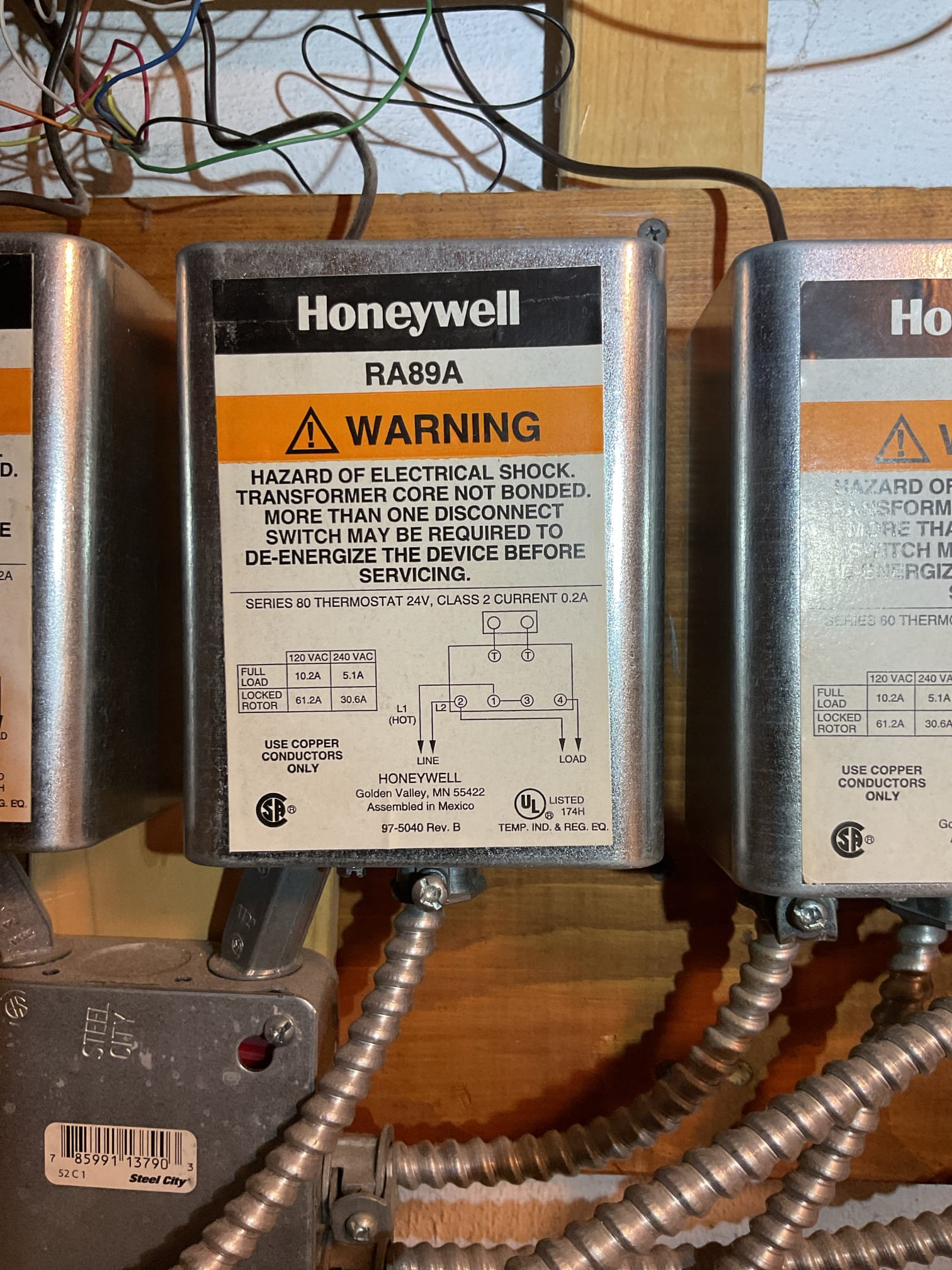 When I arrived and tuned boiler on I found 13 volts between TT on each of (6) relays. And relays were chattering. 
Relays are shut or partially shut for each zone even if there is no demand for the thermostats. Even when wires are taken out of thermostats altogether I was still measuring 0V between T T contacts. 

Unfortunately I couldn’t resolve the issue.
I took one wire out of TT at each relay to stop the chattering for now. 
Need to schedule a return. 

Also set warm weather shutdown to 72° Meaning boiler will not operate fo space heating if outdoor temperature is 72° or higher.n
