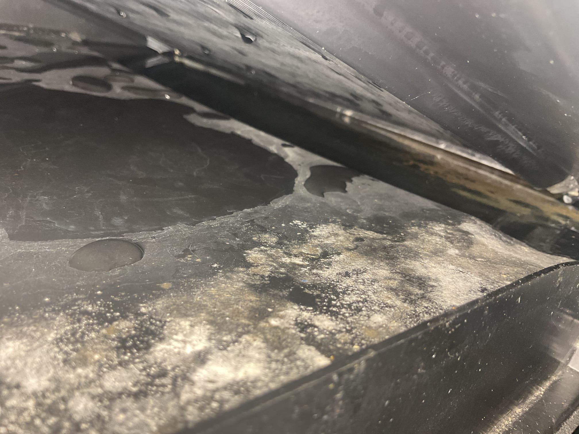 6/7/26. Found drain pan full of water when I arrived. House sitter was on site. Went up in attic and removed water from auxiliary pan. Took off panels and found drain pan was spilling over in the back. Found unit was off level. We installed the system August 12, 2024. Also found breaker tripped to air handler in basement. Found water was getting inside high voltage and tripped breaker. Dried out cabinet as much as possible. Went in back of air handler and removed water level with isolation pads. Took photos of level. After re leveling air handler all water drained out correctly. We were out on 5/29/26 to unclog the condensation drain. A/c is working properly at time of service. No charge 2 year guarantee. 