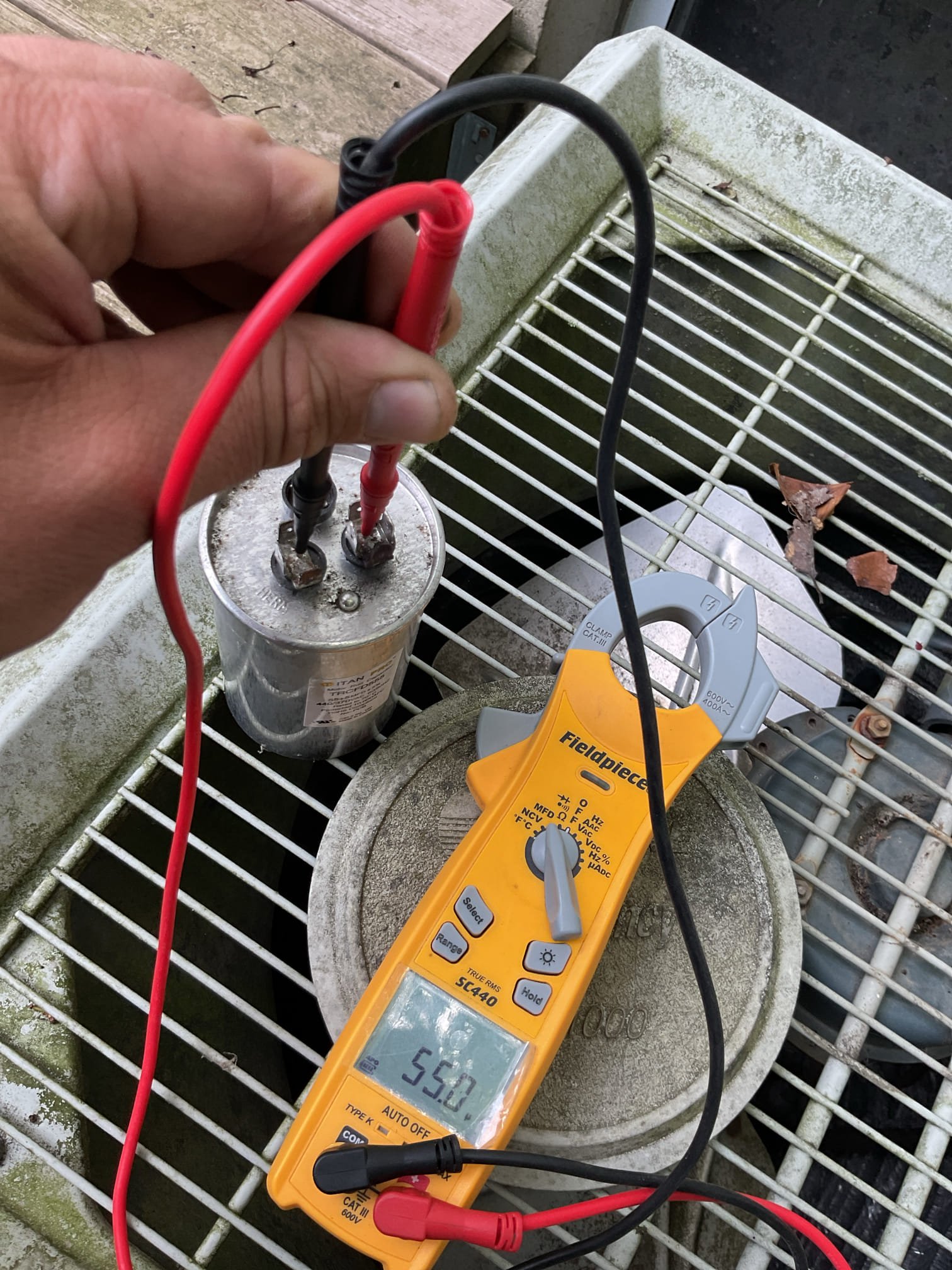 Equipment is 4 Ton AC with gas funace.
Dates to 2000 26 years old.

Outdoor fan not running. Determined that this was caused by the wire for the run winding of the condenser fan was detached from, capacitor. The capacitor was reading within specs so I offered to either repair the wiring, or giving that the one terminal on the capacitor was burnt to replace the capacitor altogether.
I replaced the capacitor (55/5 uF) and redid wiring with new connectors. 
*Contactor is newer and there is a Superboost hard start kit.

Afterwards tested system. Found r22 pressures to be low. System is undercharged on r22 which is an outdated refrigerant. 
245/58 40SH 4 SC outdoor temperature 72°
System will not cool well of at all and the indoor AC coil could freeze. 
She is going to keep an eye on it for now. She will call us for consultation after looking at her schedule
 
The only feasible solution is to upgrade/replace HVAC system. System is well beyond replacement age.

Homeowner decided on diagnosti