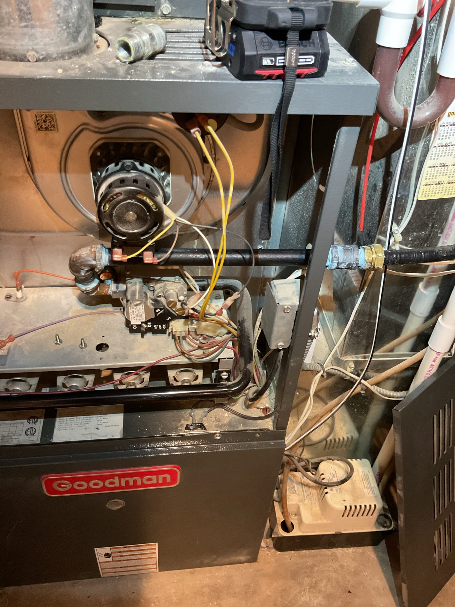 Completed AC tune up for 3 Ton Goodman AC system
19 years old 

Replaced 20x20x1 filter. Cleaned the 12x12 basement filter in floor grille. Homeowner will order 12x12x1. 
There is a pop in the return drop when blower ramps up and shuts down. This is fairly common, not a concern. 
Blower wheel has considerable amount of dirt build up. Provided estimate to remove blower wheel and clean wheel and housing. Will improve/increase air flow if cleaned. 
Indoor has some rust as to be expected given age of system; outdoor coil in good condition 
Inspected wiring, controls, electric motors and components; left estimates for surge protectors 
Measured temperature split (18.5) and static pressure 
Inspected drains; cleared EZ trap, tested pump; added treatment tabs to drain pan. Recommend installing a water safety that will
 Shut equipment down if water is detected on floors near indoor equipment. Provided estimate for wet switch, 
Checked integrity of compressor motor (mega ohm test)

Assessed ref