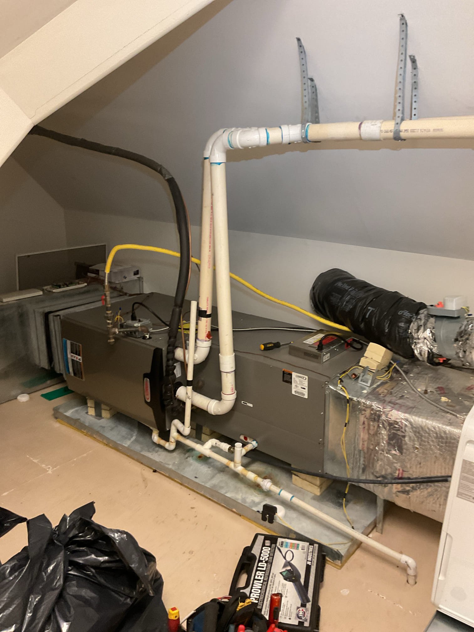 There are (3) systems in the house.

1.Basement (1st Floor) Uplflow Lennox Icomfort thermostat with (2) zone thermostats. 
2. Second floor system; furnace horizontal right in mechanical room across the bathroom on third floor. * Today’s problem system, 
3. Second/3rd floor system furnace in 3rd floor bedroom closet. *This is the system Kurty identified refrigerant leak and charged on 6/1/26

Todays call was concerning the other 2nd floor system (horizontal right). 3 Ton AC/Gas Furnace 11 years old. Found refrigerant leak at indoor coil using electronic leak detector. System is considerably low on refrigerant. Running at 60 psi. Discussed various options including replacing HVAC system And replacing indoor coil. They wanted to charge the system for now. Charged system 4# R410A refrigerant Final pressures 221/116 6.6° SC 14° SH. Outdoor temperature 68°

We cannot guarantee how long refrigerant will last. 

My professional recommendation is to replace the (2) second floor HVAC systems. Bo