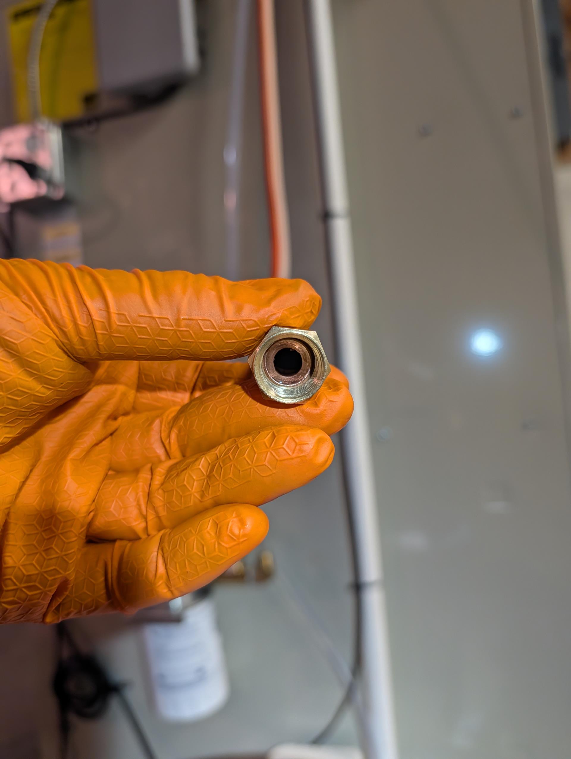 Issue is small oil leak on flare and fitting at inlet of filter. 

I was able to get 1 more turn out of fitting, then Re-flared and used new 3/8” nut>tightened. 
Cycled furnace 2X with 5 min run time. No oil leaks observed.
Set post purge time to 15 second on primary control, updated primary control firmware
Wired water safeties to produce custom alerts “water in equipment pan”, “clog detected in drain line” “condensate pump error” Each safety will lockout cooling and energize fan. 

System operating well at this time. Told him to leave a paper towel under the problem fitting for a few days and keep an eye on it. 

