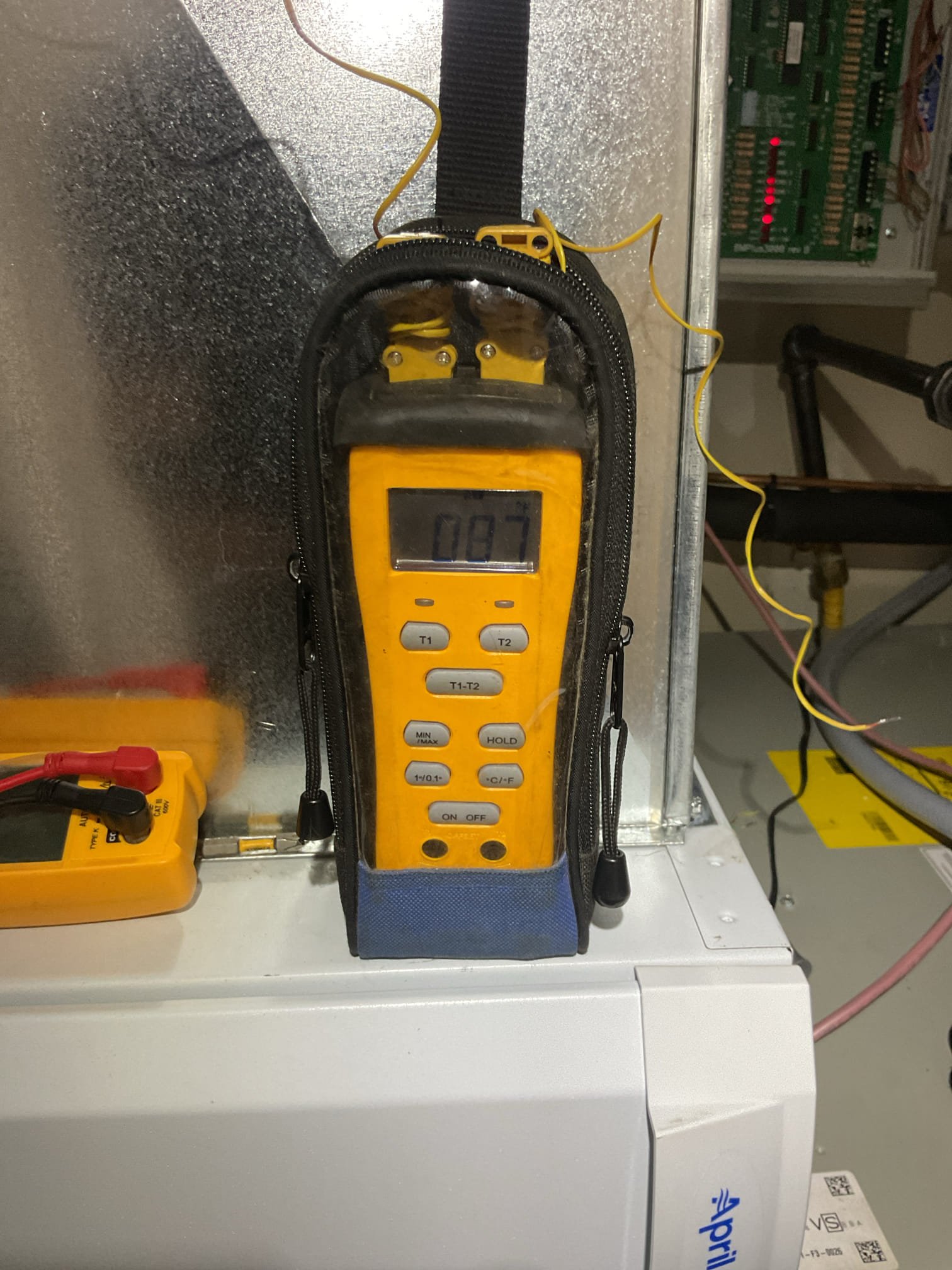 Found temperature split and subcooling to be ok (86-65) and 13° with fan speed at 1050 CFM (350/ton)
I set fan speed to 1200 CFM
Completed wiring for zoning. Installed S1200 configured and wired to Thermostat zone 2 contacts on EWC zoning board. 
Set 2nd Fl Thermostat to Cool 88.
Zone 2 will now close thereby forcing more air to zone 1 first floor. (About 80 fpm or 20-30 CFM at each register)

Afterwards tested system.
Operating well at this time. 


