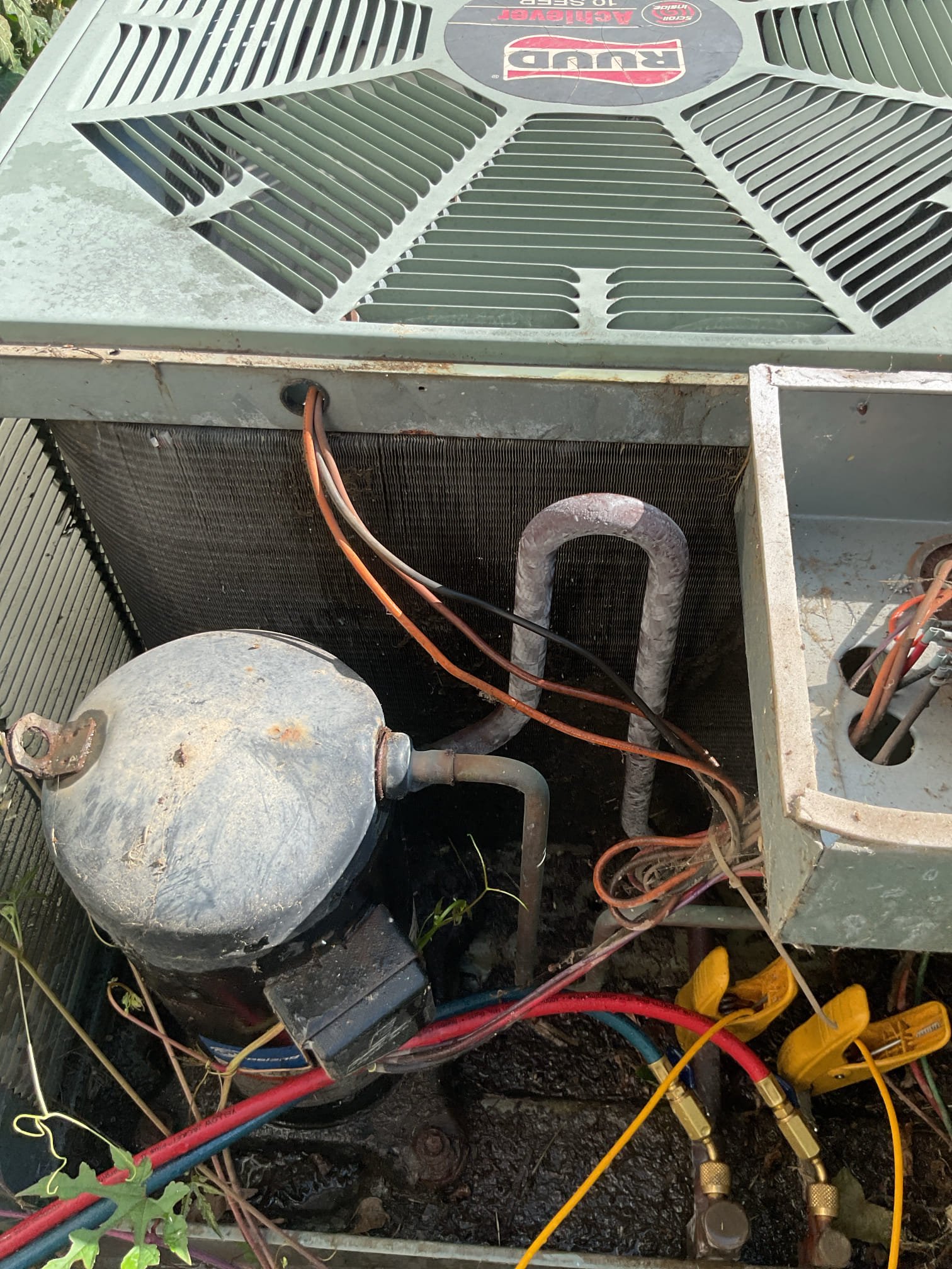 Completed tune up for 3 Ton R22 system.
Equipment is low-boy oil furnace with 3 Ton AC. Dates to 2002 24 years old.  *Very tight space

Replaced 20x20x1 filter with a 18x21x1 that I cut from a 24x24x1. The 20x20x1 is too short on one side and too long on the other,
Inspected indoor coil as best as possible, cleaned back sid of outdoor coil with available hose.
Inspected wiring and controls. There are no surge protectors. Provided email estimate. 
Inspected drains. There are no water safeties. Left estimate for ez trap and and estimate for wet switch, Cleaned condensate pump.

Checked refrigerant charge and pressures. 213/52 R22 system is low on R22. There are no sensible refrigeration repairs to offer for R22 equipment. System is 24 years old well beyond replacement age. Strongly recommend upgrading system. 

*PECO has offered to run them gas to the house for a price. They want to do this before considering upgrading or replacing the HVAC system. 

AC system is operable but will underp