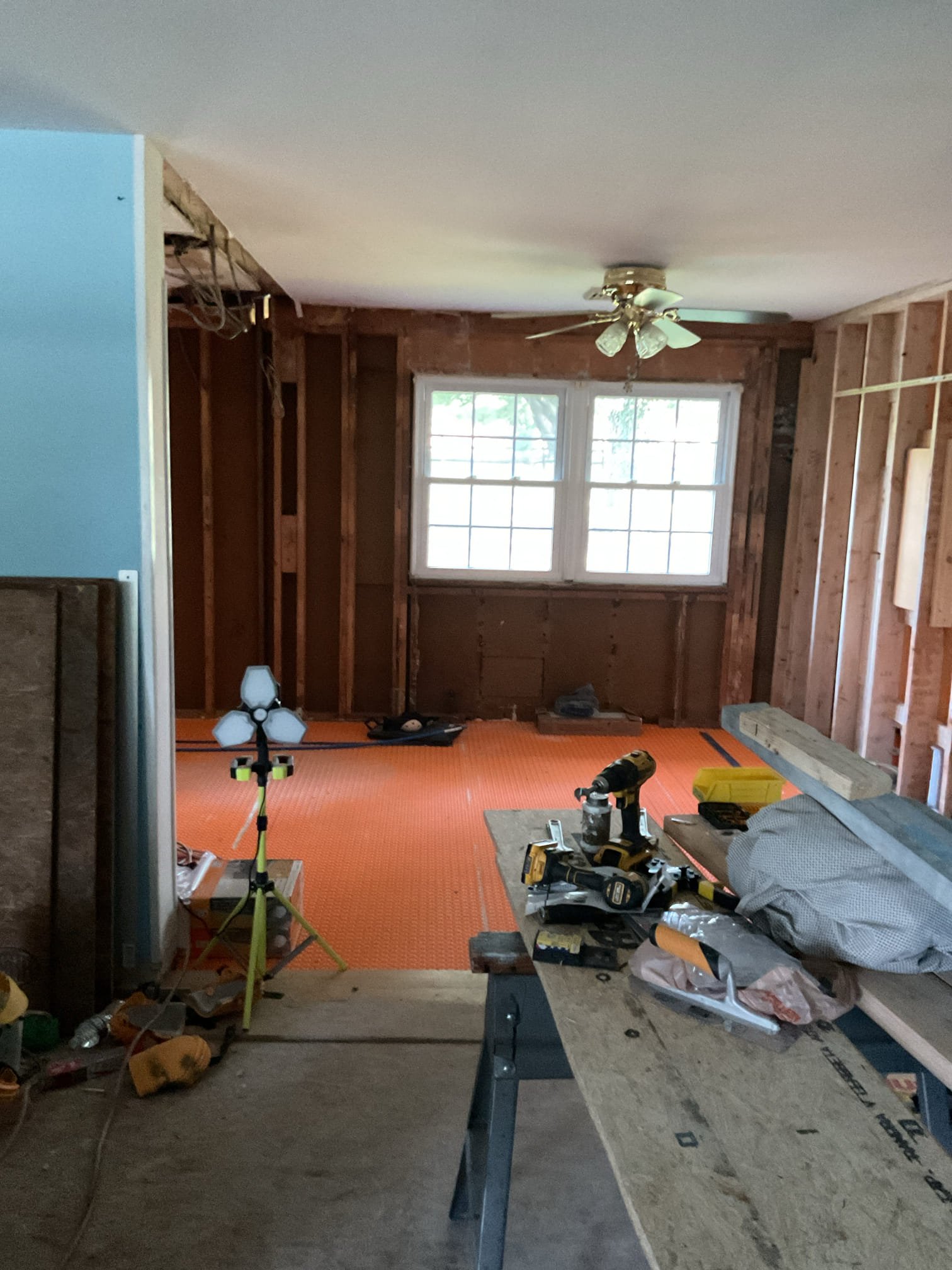 Arrived for tune up for 2.5 Ton AC. 
The house is being remodeled.
Will not be lived in for at least another year.
AC is very old and has been underperforming for a few years.

They drained boiler and cut out (2) sections of hydronic baseboard where new kitchen will be *Formerly the dining room. 

There is one section of under slab radiant floors nor the back room. With its own thermostat, circulator and relay.
We will need to make a site visit to determine options moving forward. I.E replacing AC with heat pump and electric backup. 

They are going to build an addition in the back side of house as well which would require a Minisplit install. We may take into consideration adding a Minisplit head to both this future addition AND the small room that is currently being heated by radiant floors.

AC is not being used and house is under renovations.