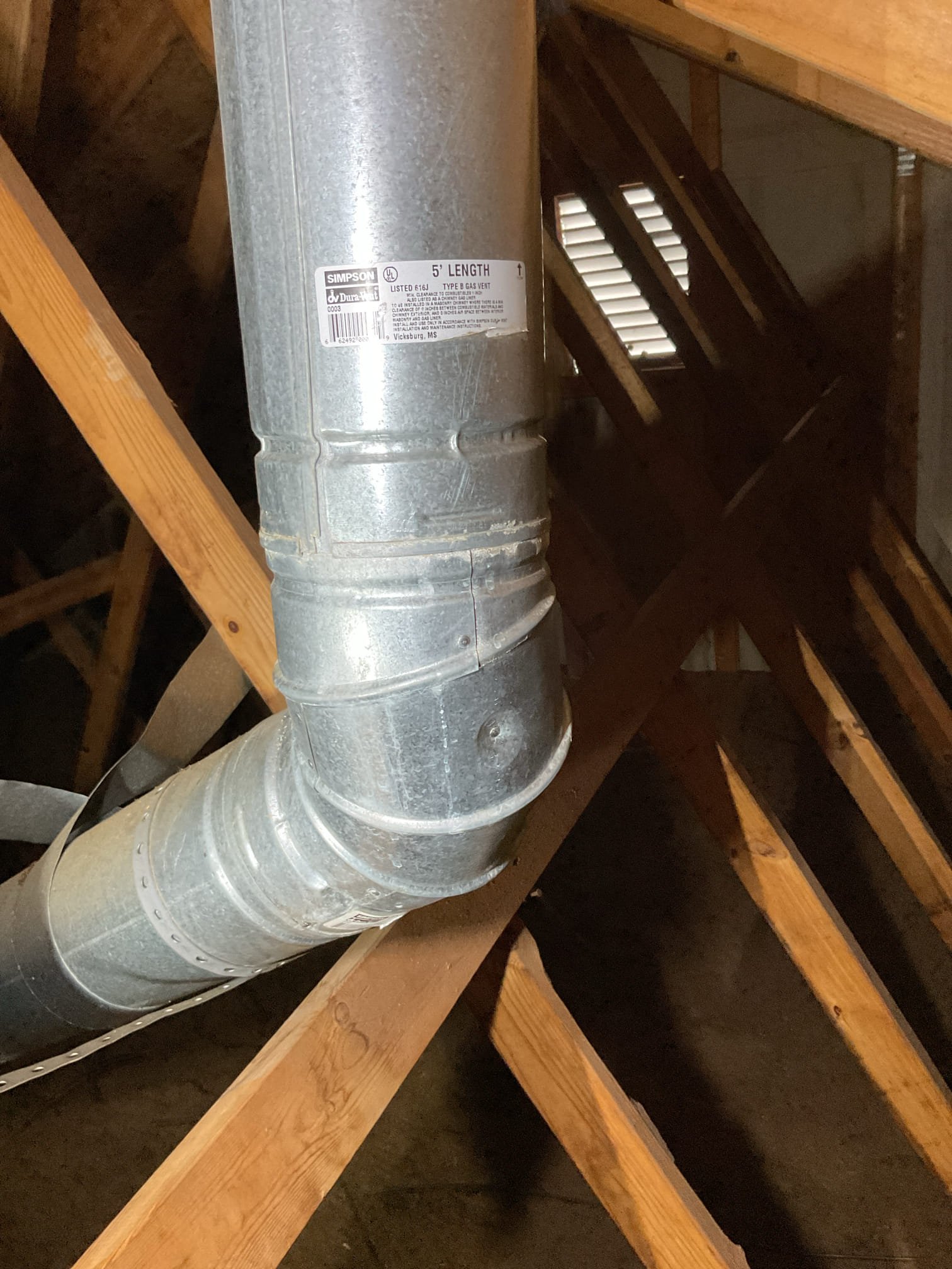 Luis 7-30-26 
 Customer called to check exhaust pipe termination up in the attic, customer thinks roof jacket (boot is leaking) I did not see any issues with boot. Most likely will be exhaust gases condensing before exist house, I would recommend contacting chimney/roof company to replace chimney cap. Other option could be system replacement with water heater so we can exhaust gases on the side of the house with pvc. Customer will try contacting roofing/chimney company for further assistance. 