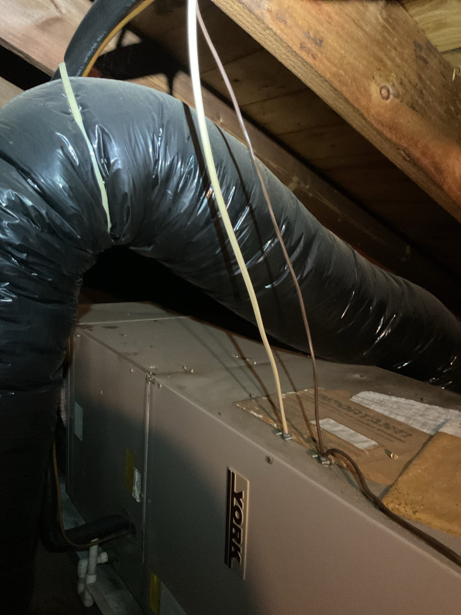 No cooling
Equipment is 3 Ton AC/ attic air handler dates to 1991 based on York serial number nomenclature. 35 years old
Ceiling grille filter rack. 

Found failed capacitor and 30A double pole breaker was tripped. 
Ultimately determined compressor is shorted to ground. Breaker will instantly trip if compressor is energized Verified this with 2 different meters measuring directly from compressor.

Only sensible thing to do is upgrade and replace the HVAC system.

Heat is oil hydronics. Homeowner would like to go to heat pump with elec
Hot water 40 gallon electric. He says the capacity is not there. One personn takes a shower and it takes 2 hours to get hot water. Tank booster may be the solution.n

We will offer heat pump air handler with electric auxiliary heat. Current.y wire to attic feeding air handler is 14 gauge. *I could not identify breaker in panel for this circuit.
AC is on a 30A double pole BRK 16+18

AC system is non operational.
We at up consultation for new system 10AM to