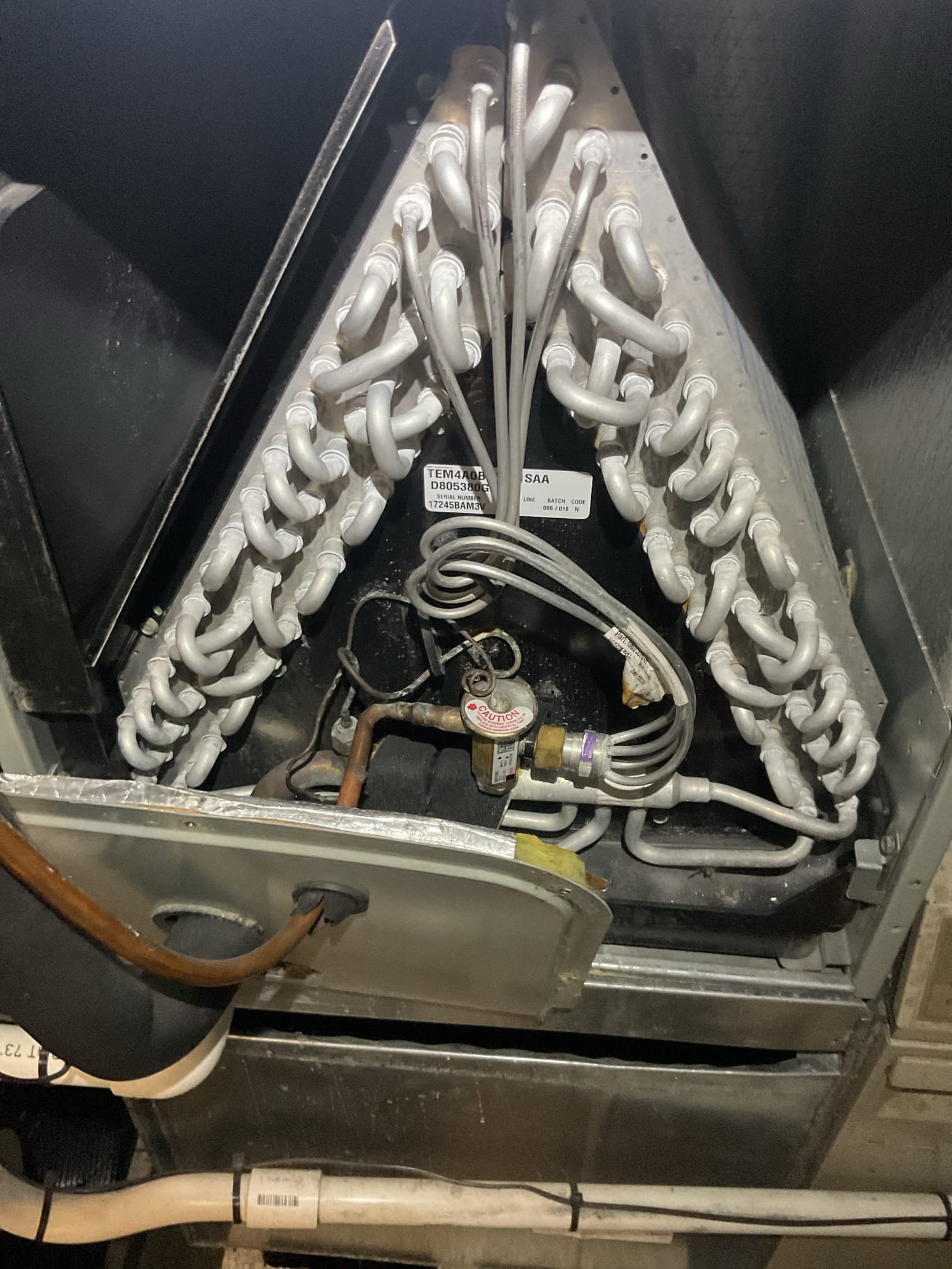 Found water in 1st Floor system drain pan. Causing float switch to break power to the outdoor unit resulting in no cooling.
Removed water from pan using wet vac>cleared trap and pan connection with brush and C02.>sprayed pan with treatment spray and tested by pouring water directly into drain pan. 

*There is a chance there is a crack in the evaporator drain pan and that is where water is coming from. I did not observe this today while here but in some cases this particular problem shows itself after drain water has accumulated in pan. 

There is a piece of 3/8” vinyl tubing being ran to this condensate pump from above. Presumably for the other air handler that was outside the pump. I put a piece of 3/4” pvc and ran the tubing inside to prevent it from getting knock out of pump. 

Replaced 18x20x1 filter 
Refrigerant pressures and temperature split excellent.

Left email estimate for drain improvements: EZ trapwith float switch that will shut equipment down in event of a drain clog/res