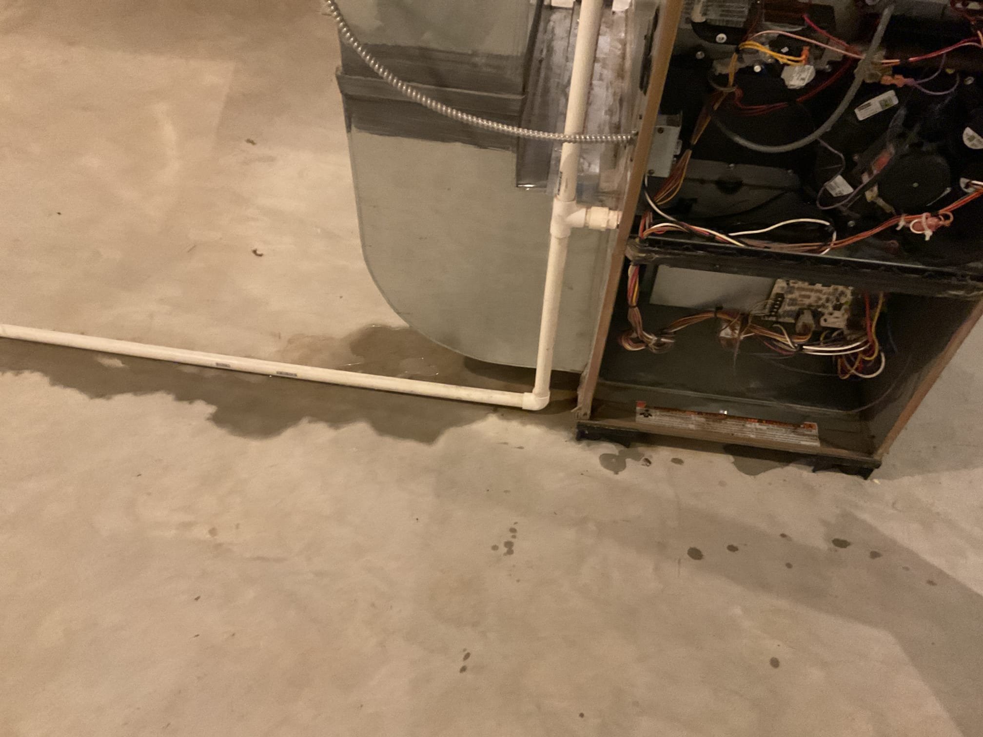 Found condensation lines for 1st and 2nd floor all tie together in basement. Found water backing up into 1st floor gas furnace and 2nd floor drain pan. Explained to homeowner that the 3/4” line that they both tie into has a major blockage. Blew out drain line with nitrogen tank both ways. Water started pouring out other side into the sump pit. Drain line is open again. 2nd floor system does have a wet switch for drain protection in the attic. Homeowner is going to suck up water in drain pan and basement with his shop vac. Drain line is flowing properly at time of service. 