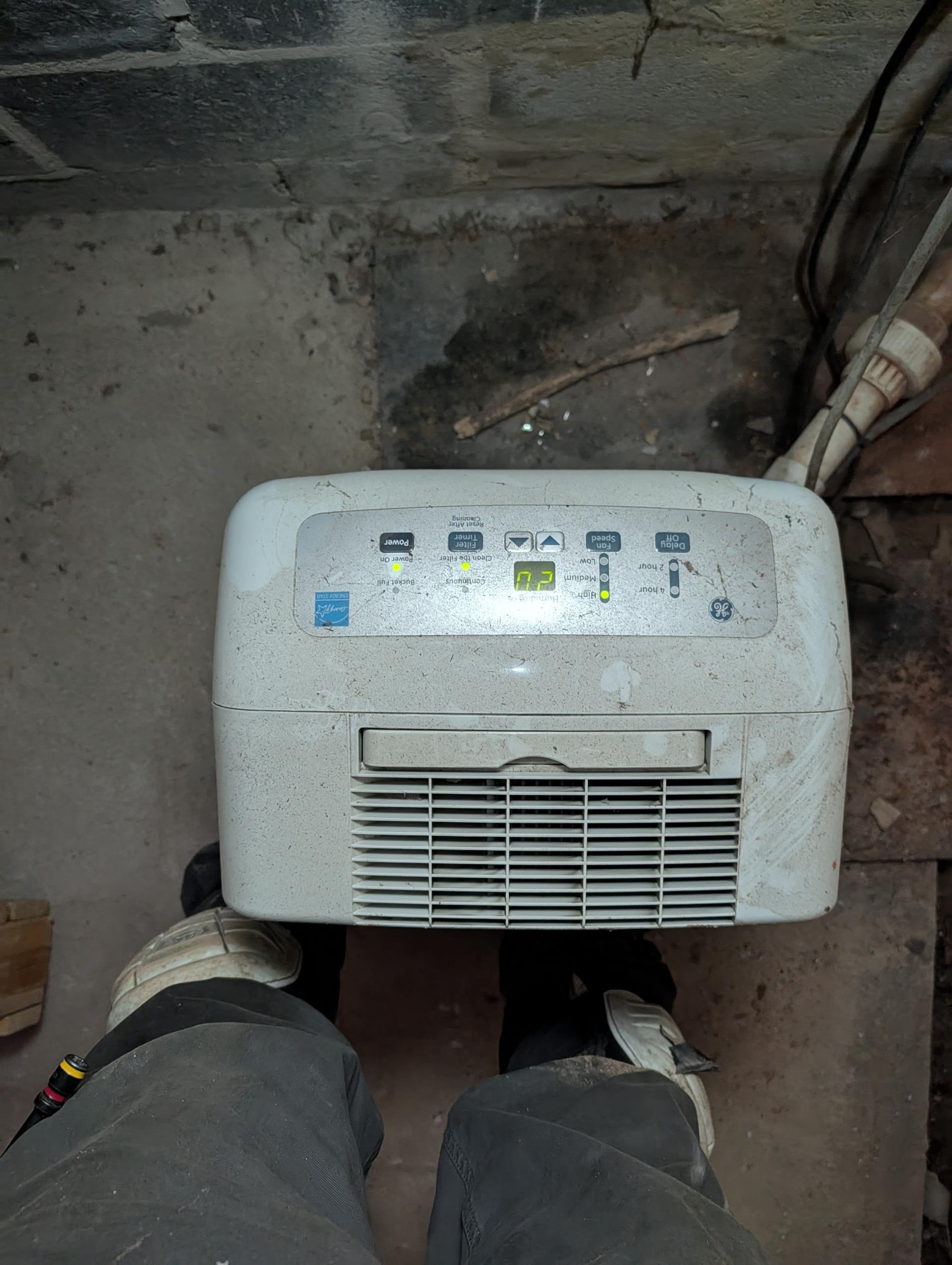 Tiny pool of water under wet switch.
The wet switch itself is sweating in the humid attic space. The roof is an older design and there are large gaps in the the gable allowing for humidity to be very high in attic. The wet switch will sweat in these humid conditions. Put wet switch back on zip tie to create an air gap underneath.
There is some condensation that will form on blower housing on these humid conditions as well recommend leaving g thermostat fan to “ON” to help keep air handler as dry and clean as possible considering humidity of attic. Ductwork is insulated. 
Verified fan speed (820 CFM) *Tap 3;  2 Ton heat pump Good

Replaced basement system filter. 16x25x1 Was very dirty recommend replacing monthly, 
Attic system filter was just replaced by homeowner. *Also 16x25x1

They had a bucket underneath condensate pump in basement that pumps water for, attic air handler. Basement also very humid pump will sweat, wrapped pump I’m foam insulation tape to prevent sweating.

Basement 