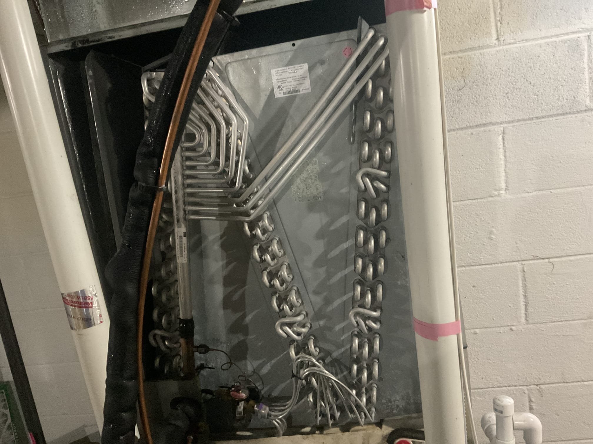 8/13/26. Fully assessed no cooling situation on 2017 Rudd heat pump system. Went downstairs when I arrived and gave system a call for cooling situation. Found water all over the floor around furnace. Homeowner recently replaced his own circuit board. Checked over wiring and dip switch settings. Went outside and checked r410a refrigerant pressures they were 301/95 with 20 subcooling and 32 superheat with a 29 degree evaporator coil, this is freezing pressures. Removed sensing bulb from suction line pipping and gave system a call for cooling again. Suction pressure did not improve. Txv is un responsive. Provided estimate to replace indoor txv but highly recommended replacement of system. He is going to decide next steps. 