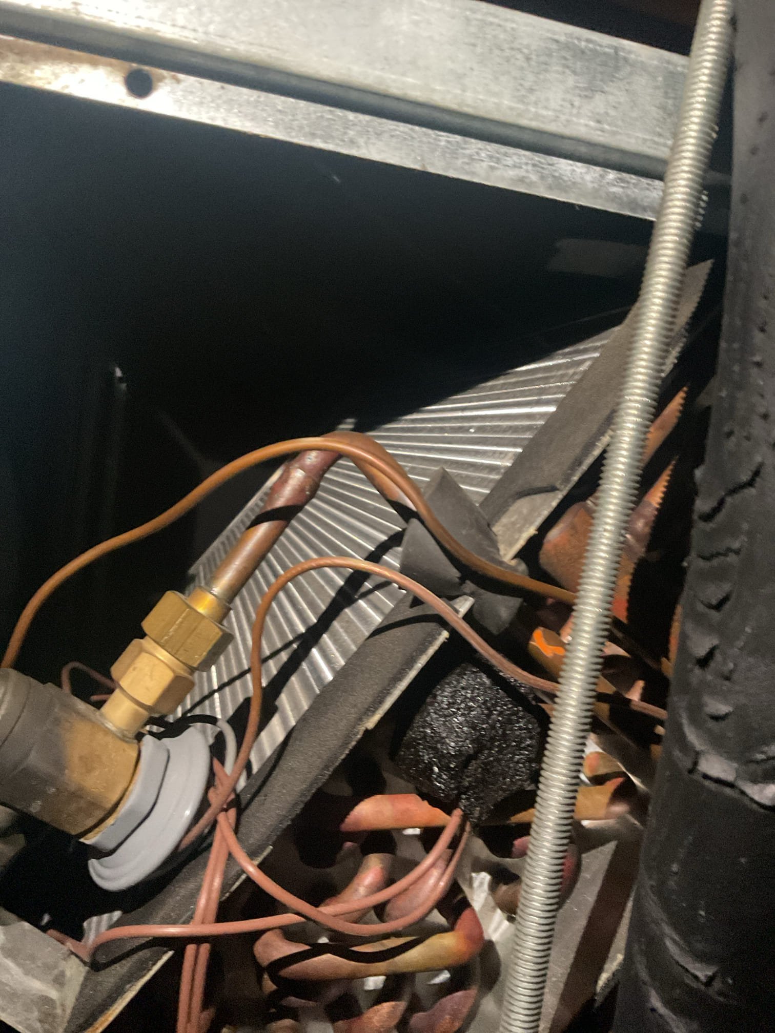 8/14/26. Fully assessed no cooling situation on 2015 unico high velocity system. Went up in very tight attic to indoor unit. Found water in drain pan. Poured water through ez trap and it had a lot of gunk in it but did drain. Found outside unit is located on top of roof. Homeowner uses (2) extendable ladders to get up to unit. Found indoor evaporator constantly freezing up. Explained to homeowner that it is more than likely a charge issue or possibly a bad txv valve. Ethier way due to being an 11 year old unico system recommended getting a replacement estimate. Explained to him if it is refrigerant these evaporator coils are notorious leakers. Set up appointment with our office for Monday. 