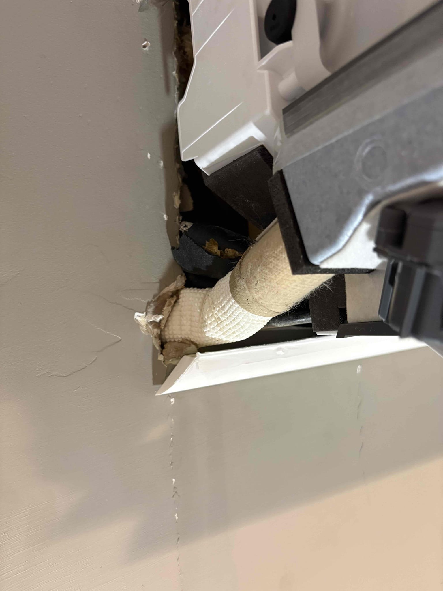 Mini split head leaking in master bedroom. Tested drain and was fine. Found refrigerant lines dripping behind head unit. Pulled unit off wall wrapped all lines up completely. Advised customer to keep his eye on it. 